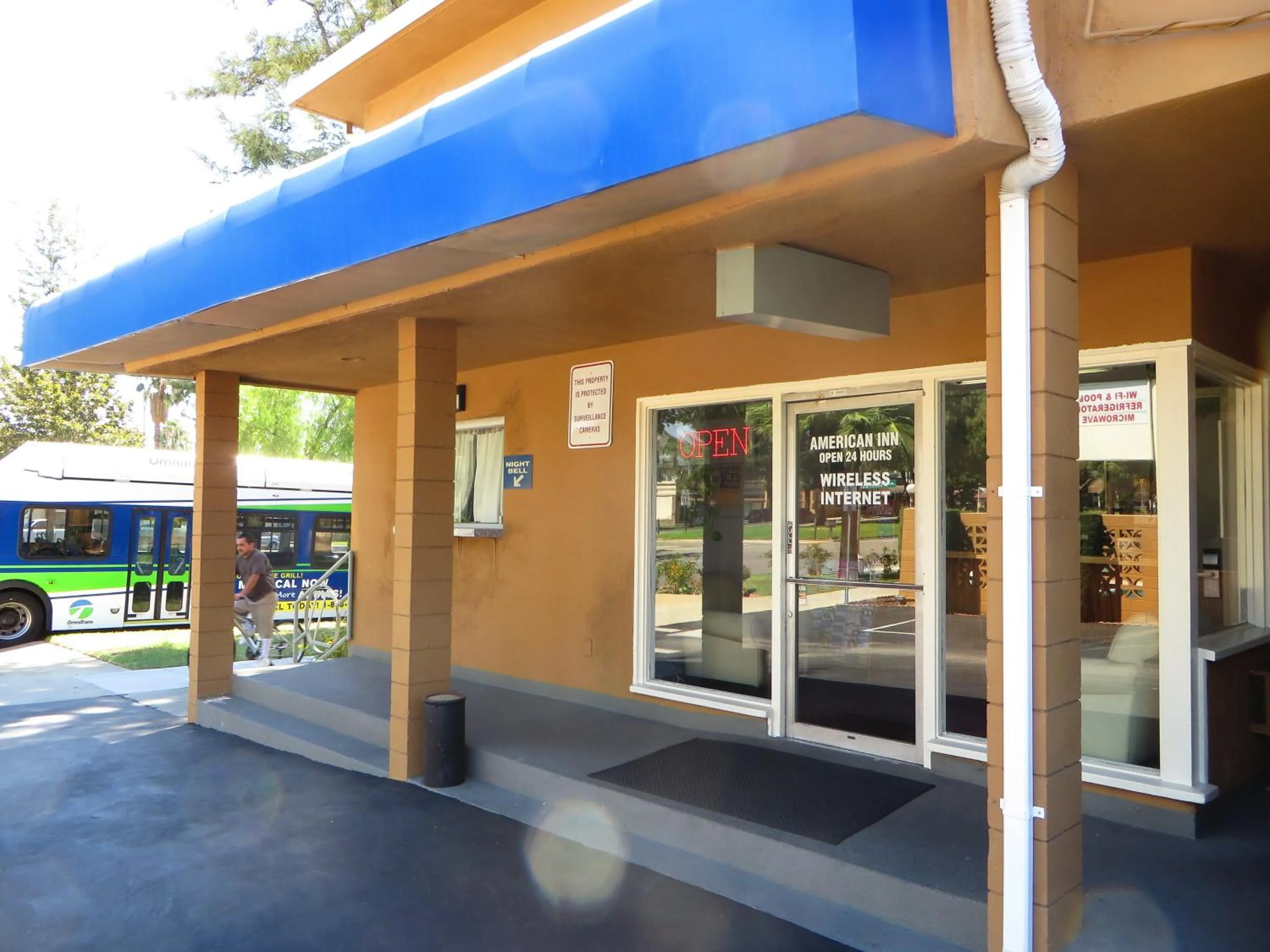 Property logo or sign in American Inn