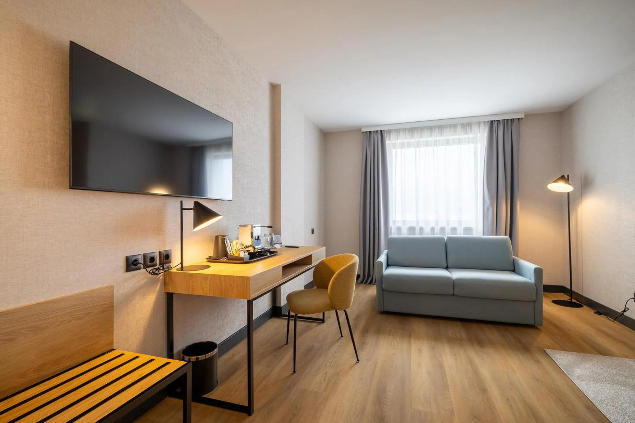 Seating area, Bed in Metropolitan Hotel Sofia, a member of Radisson Individuals