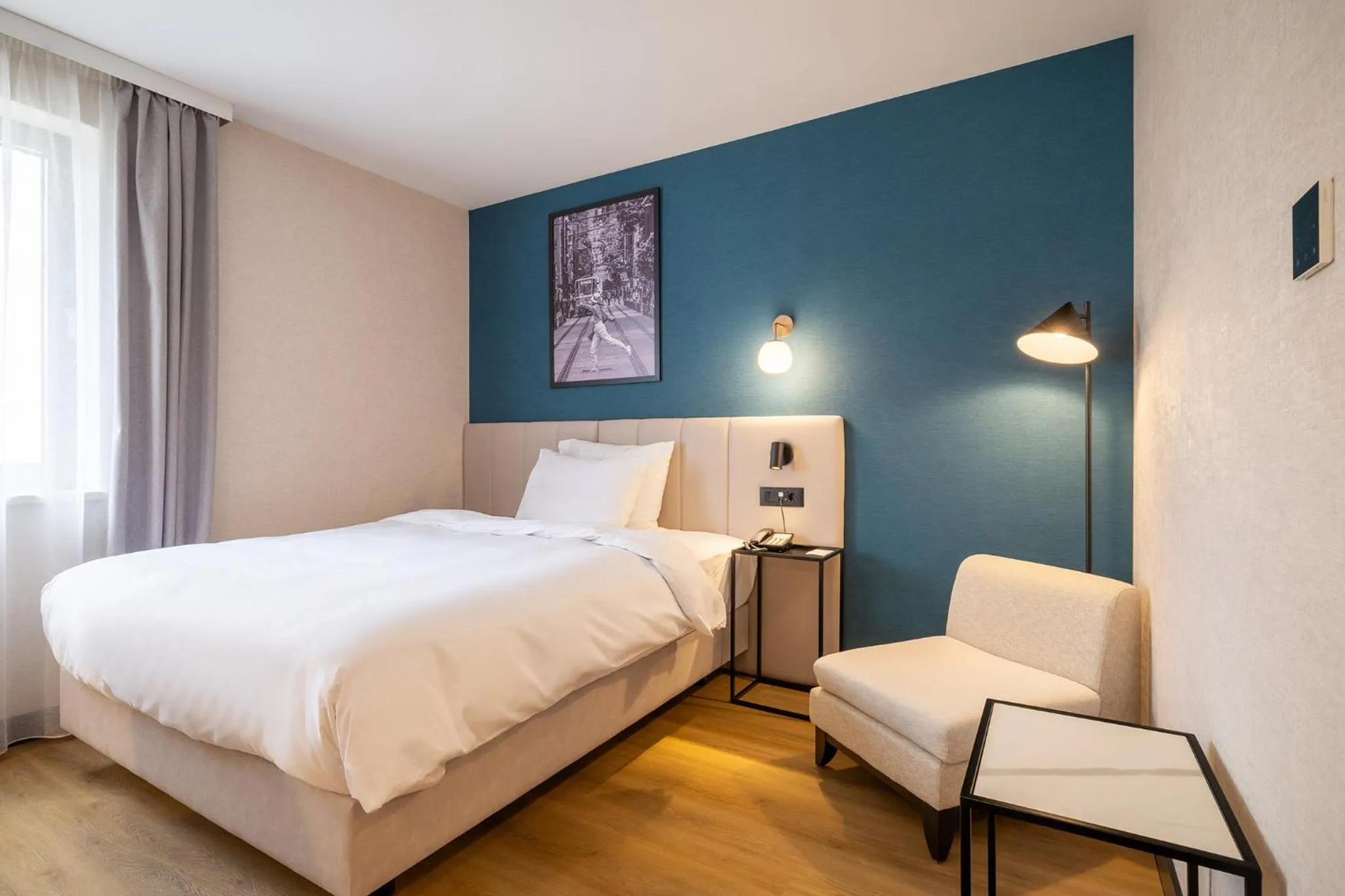 Seating area, Bed in Metropolitan Hotel Sofia, a member of Radisson Individuals