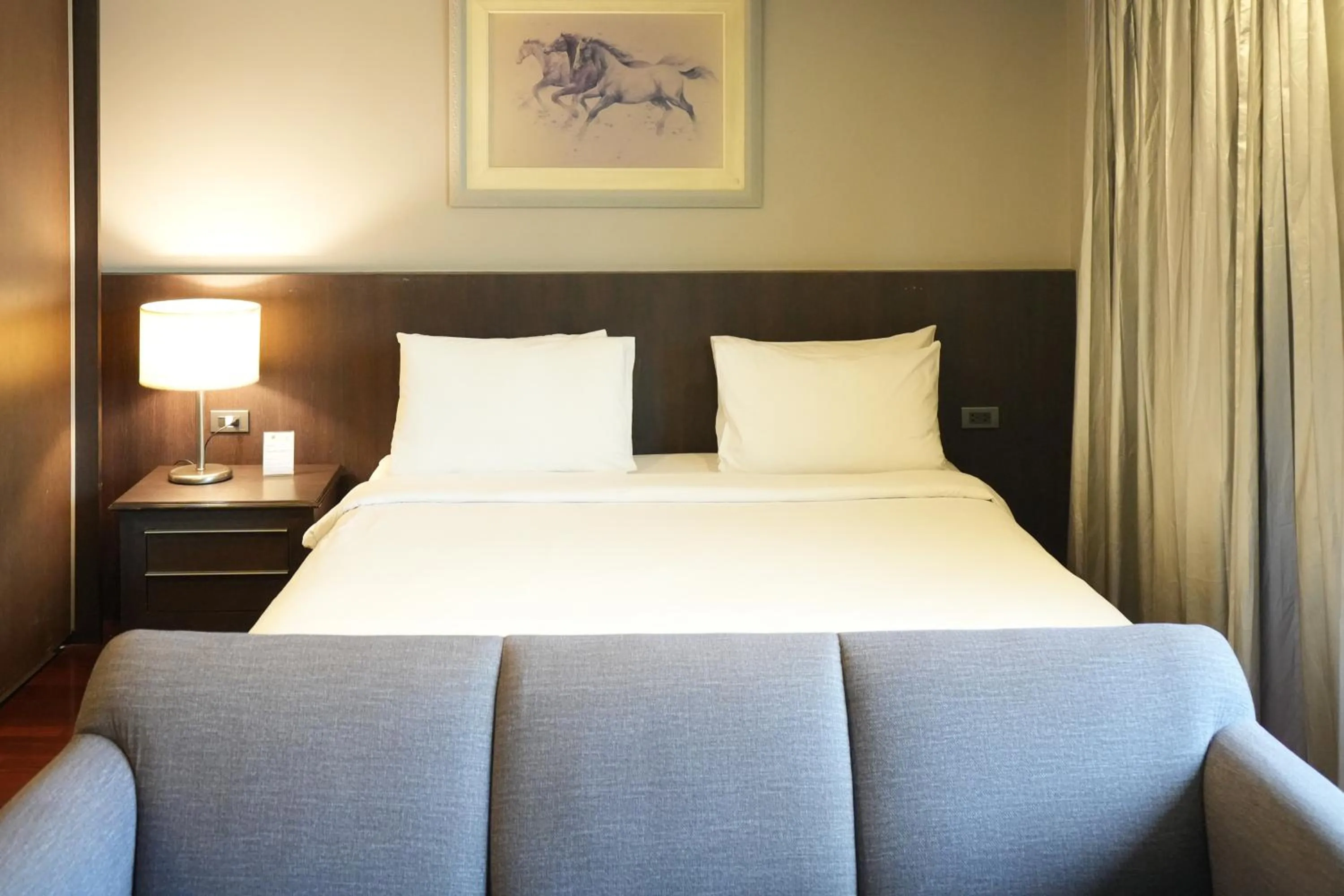 Bed in Royal Suite Hotel Bangkok