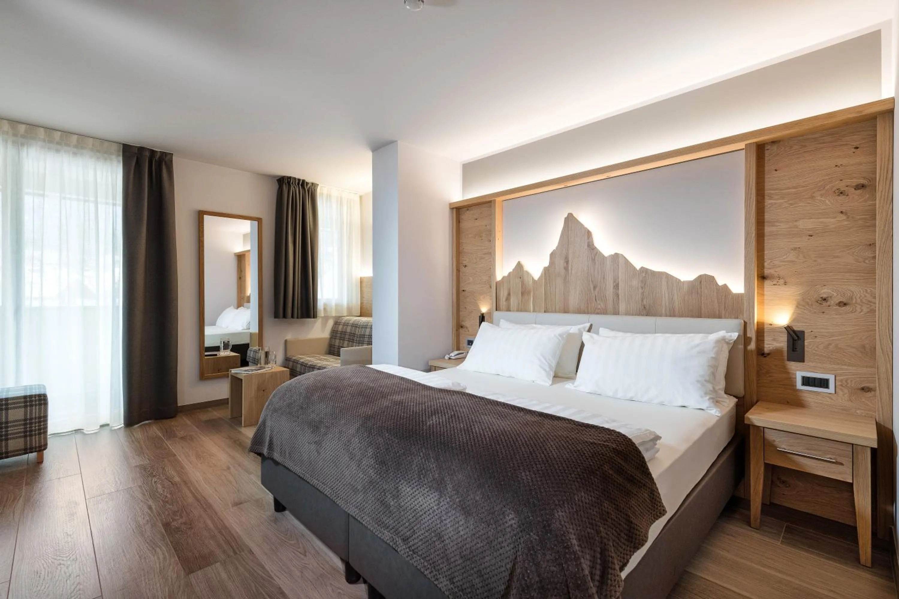 Bed in Family Hotel Serena