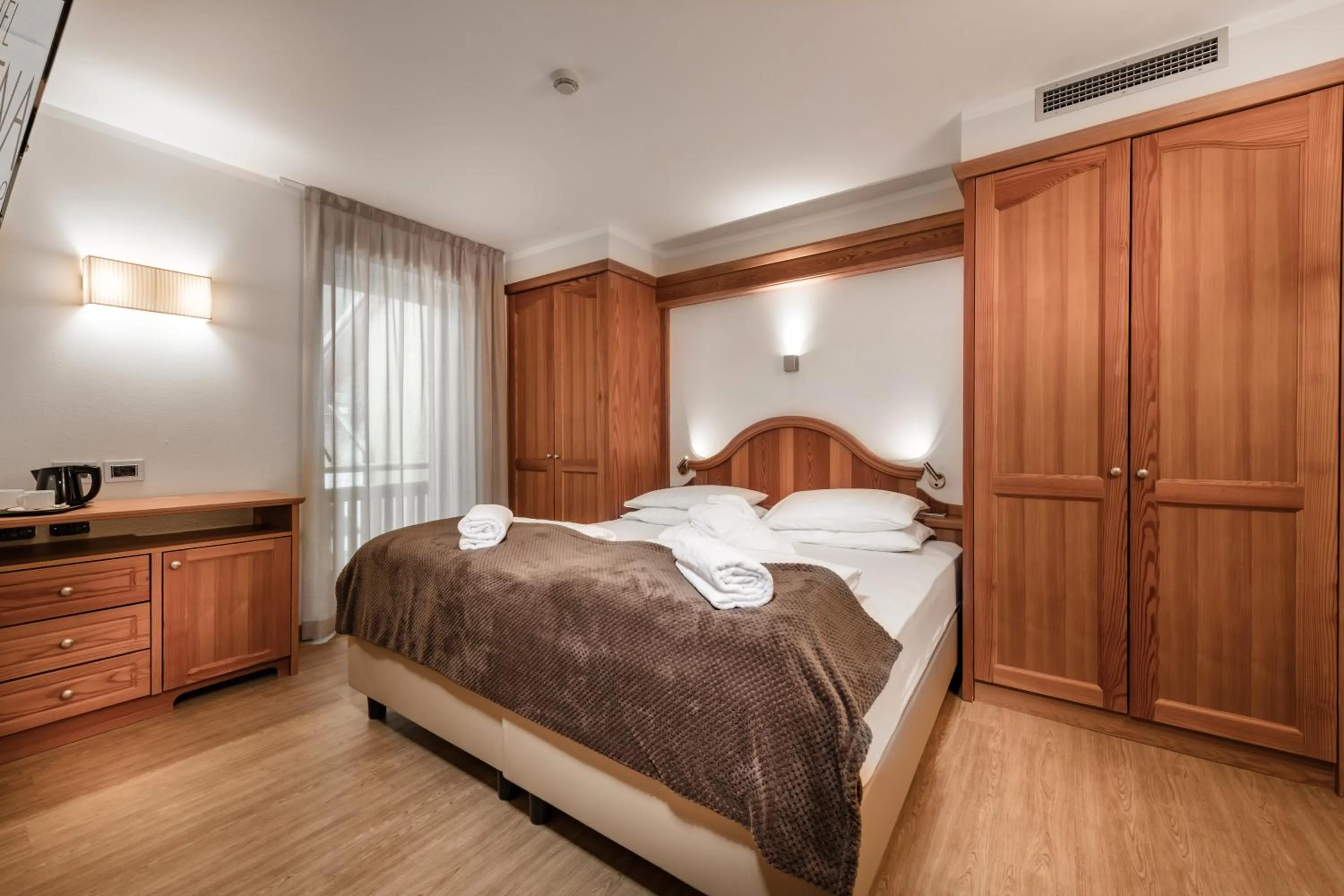 Bed in Family Hotel Serena