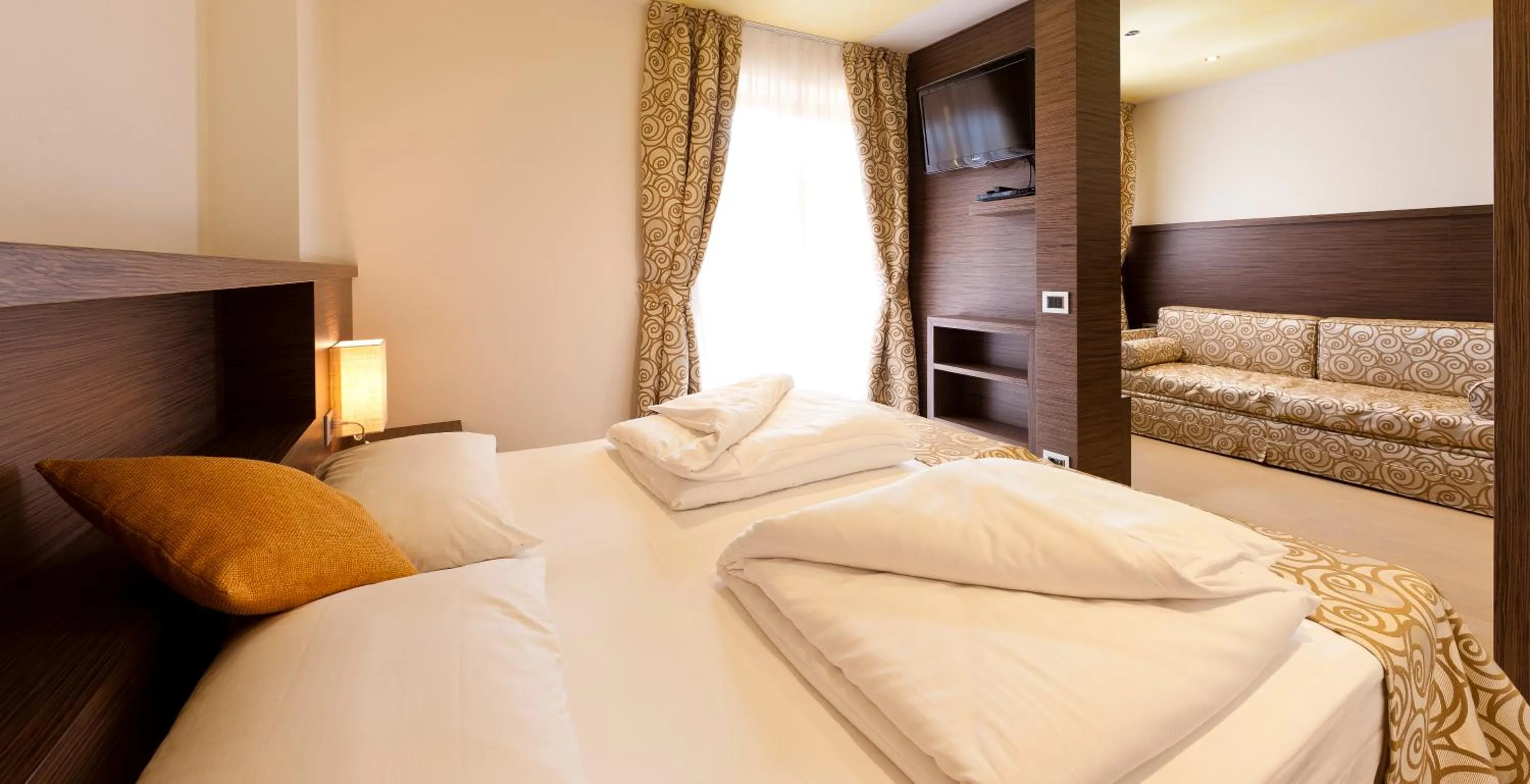 Bed in Family Hotel Serena