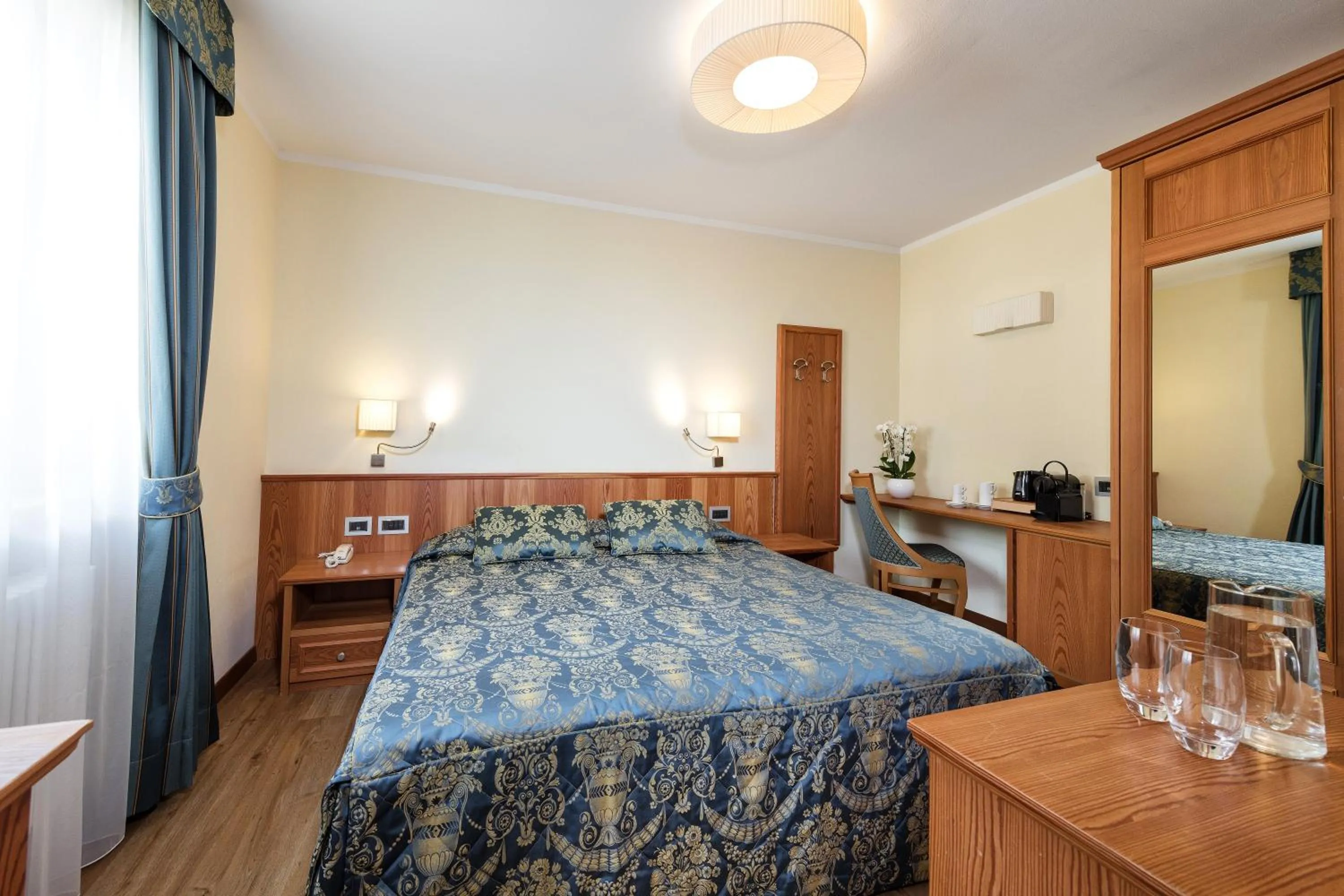 Bed in Family Hotel Serena