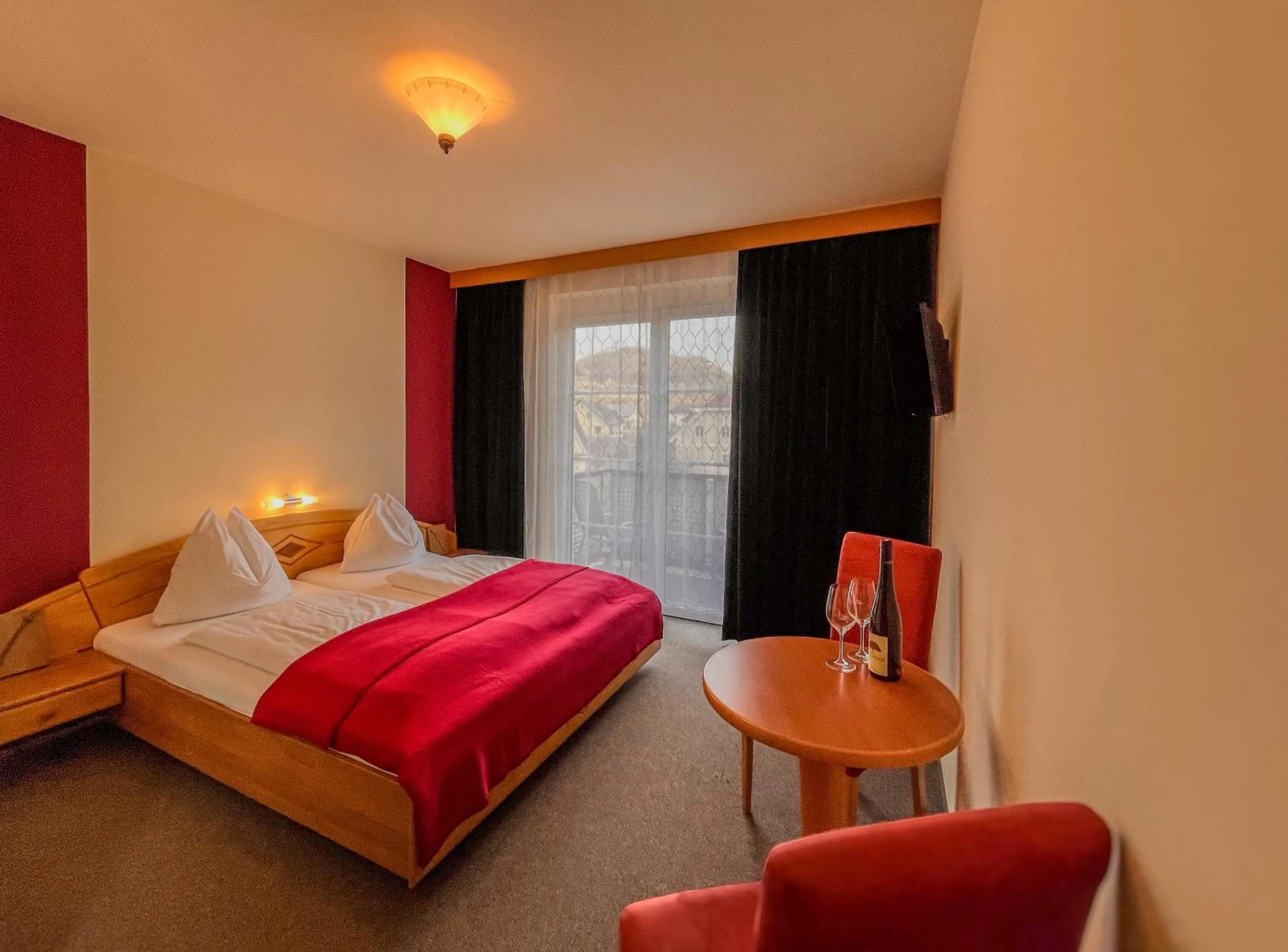 Bed in STIERSCHNEIDER'S Weinhotel Wachau & Wiazhaus