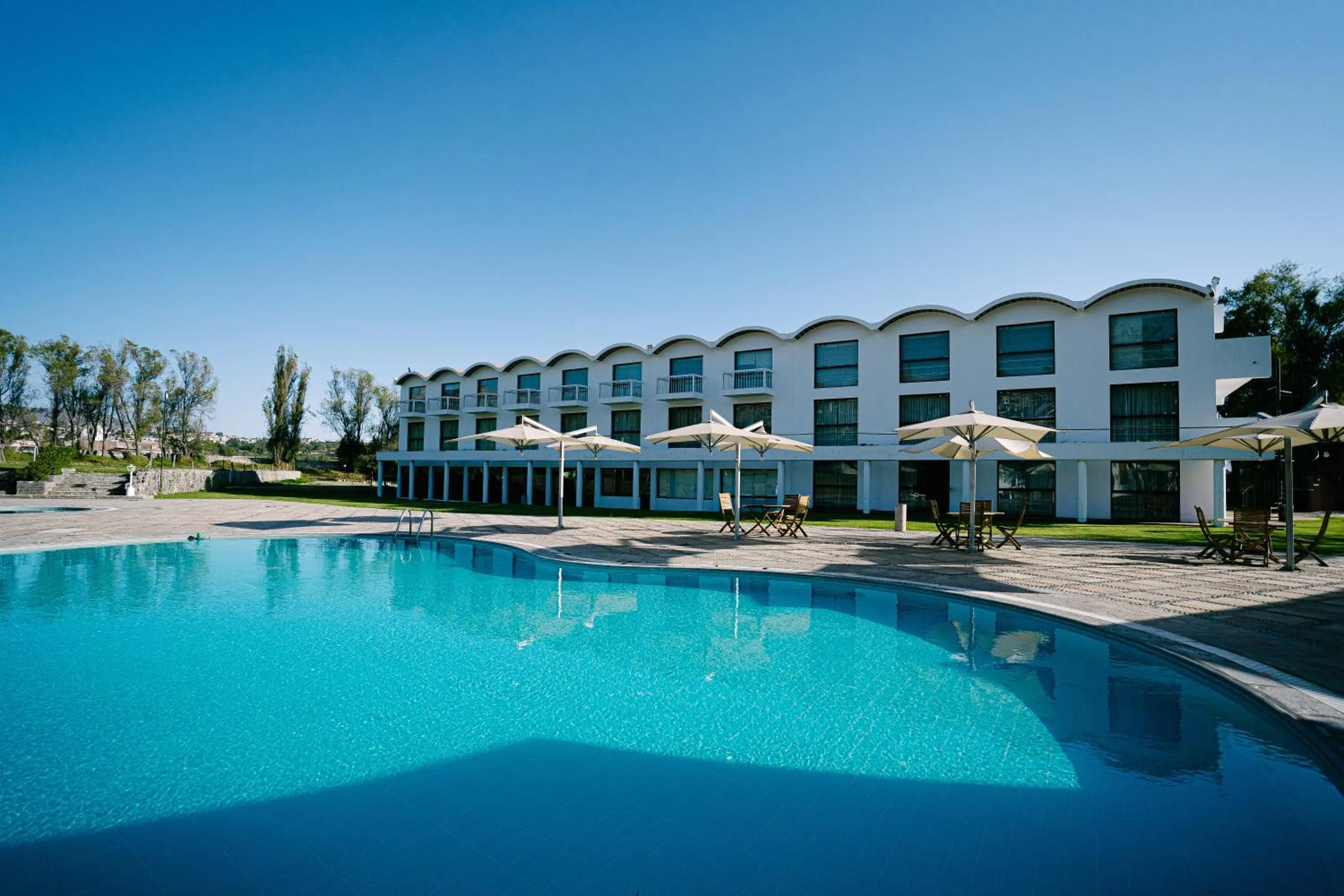 Swimming pool in El LAGO HOTEL by Luoxo