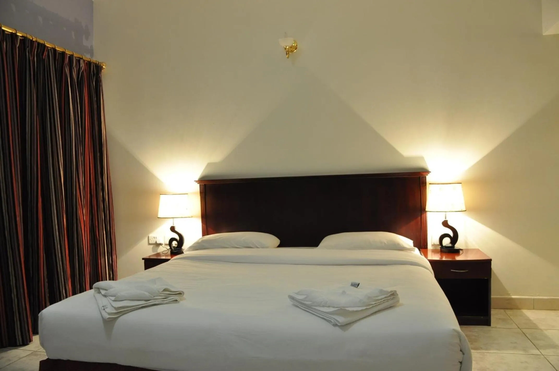 Bed in Sahara Hotel Apartments