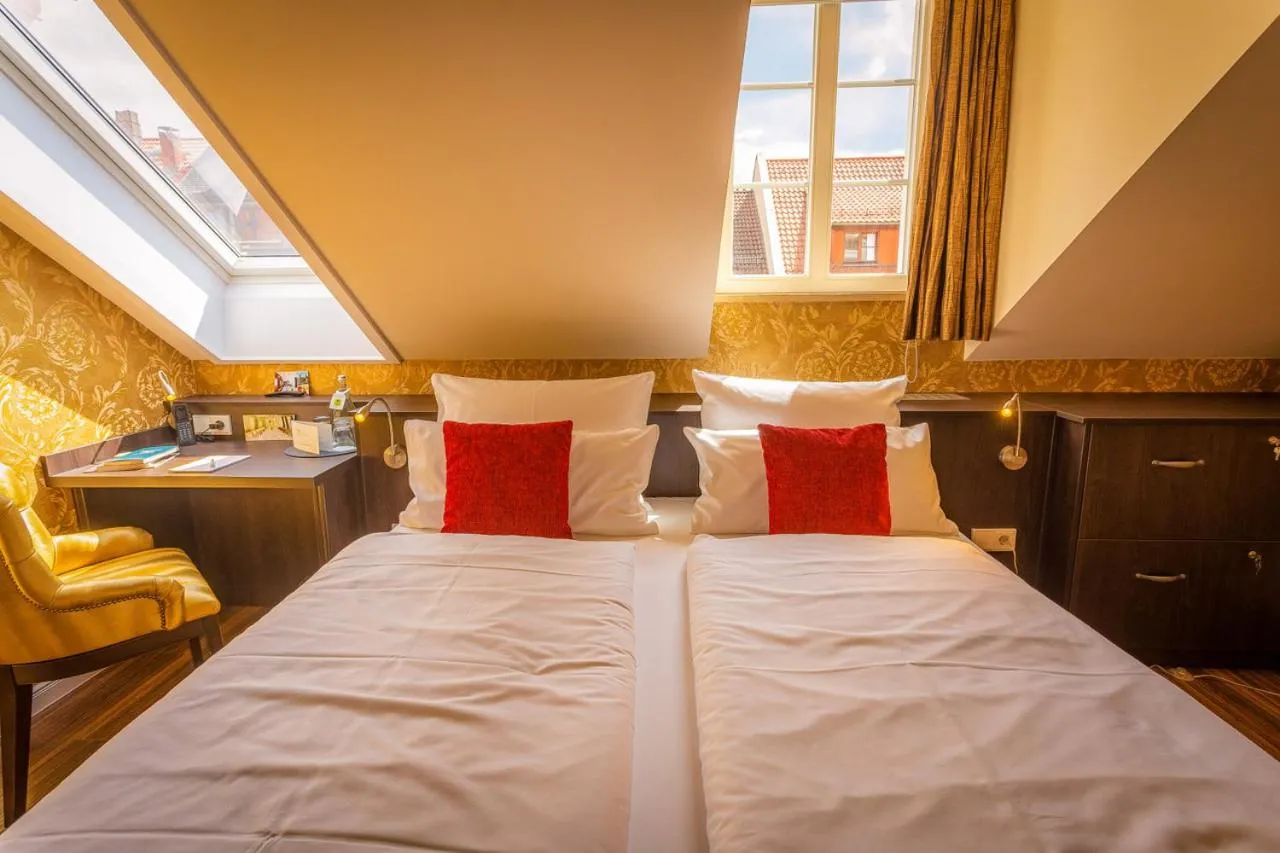 Bed in MOMENTS Boutique Hotel