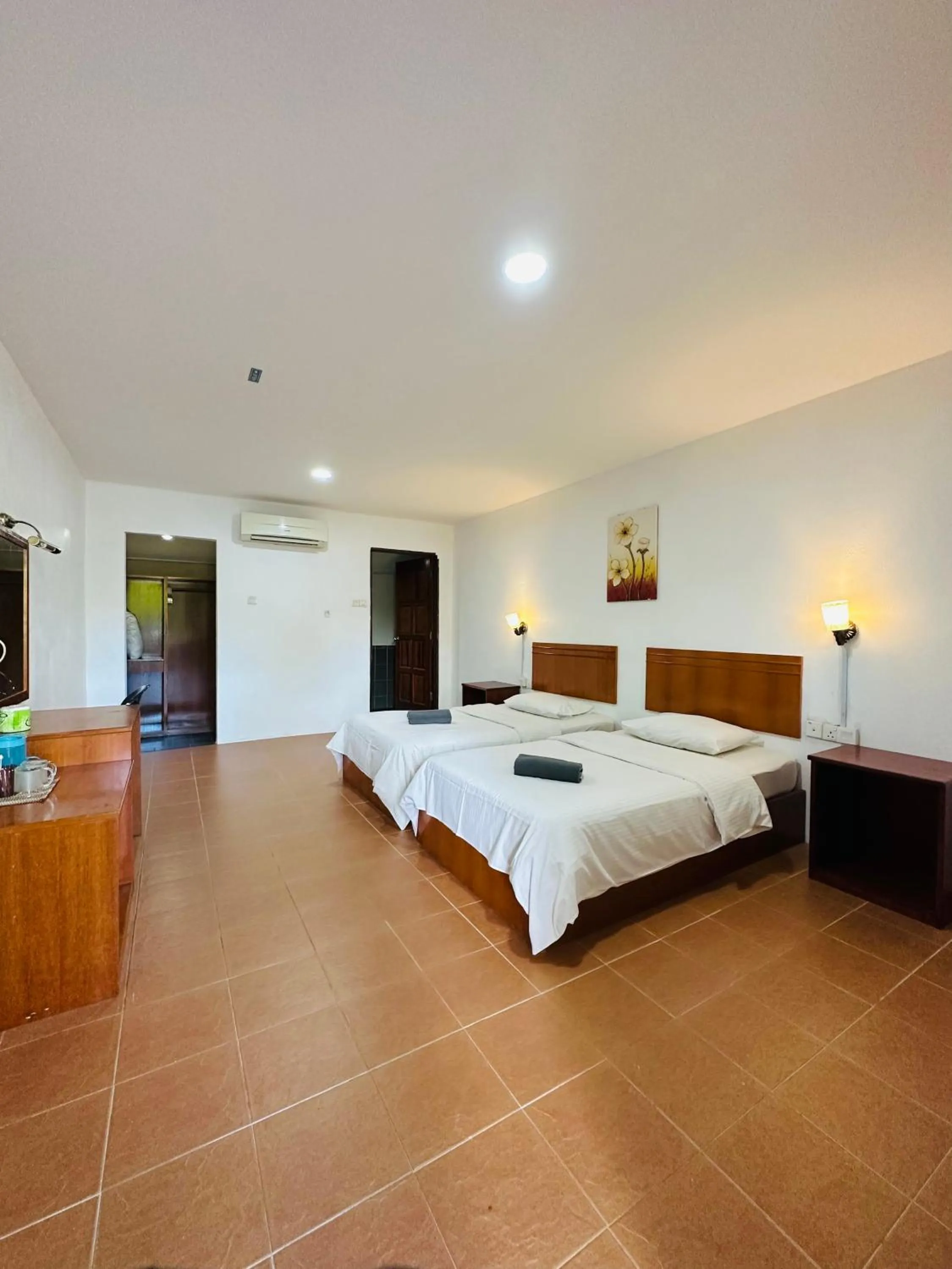 Bed in Landcons Hotel & Resort