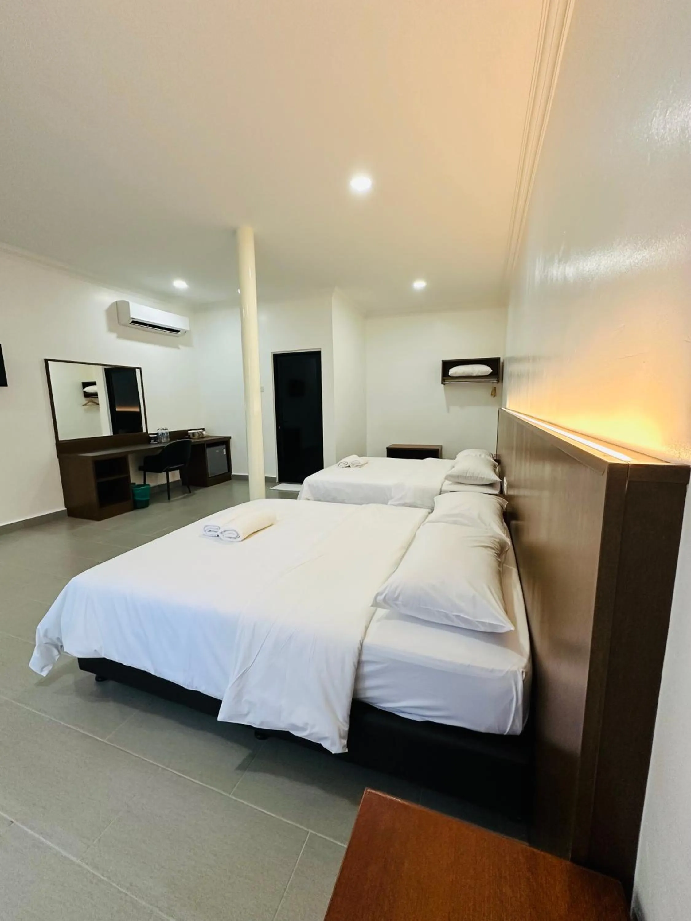 Bed in Landcons Hotel & Resort