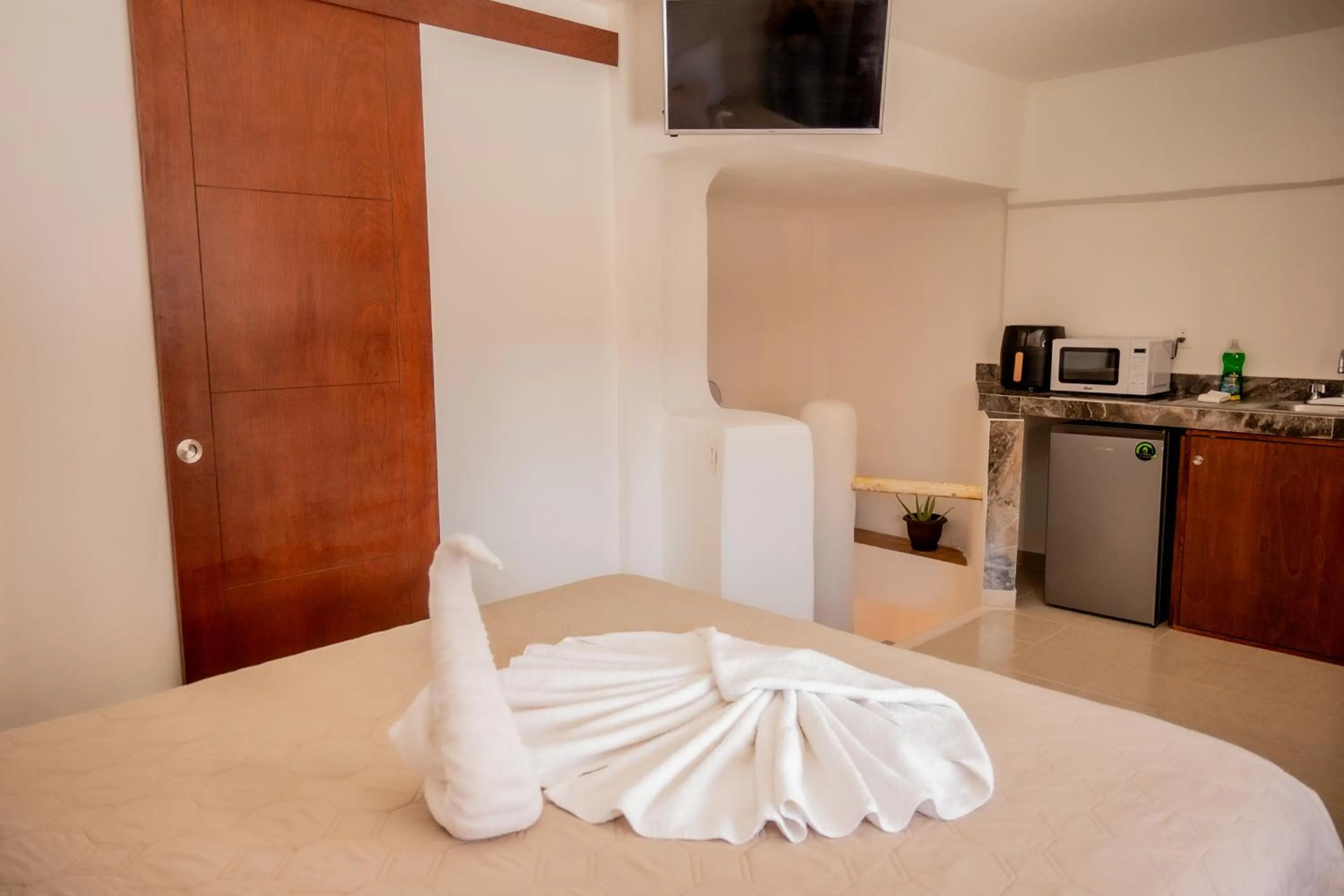 Bed in Cancún Suites Apartments - Hotel Zone