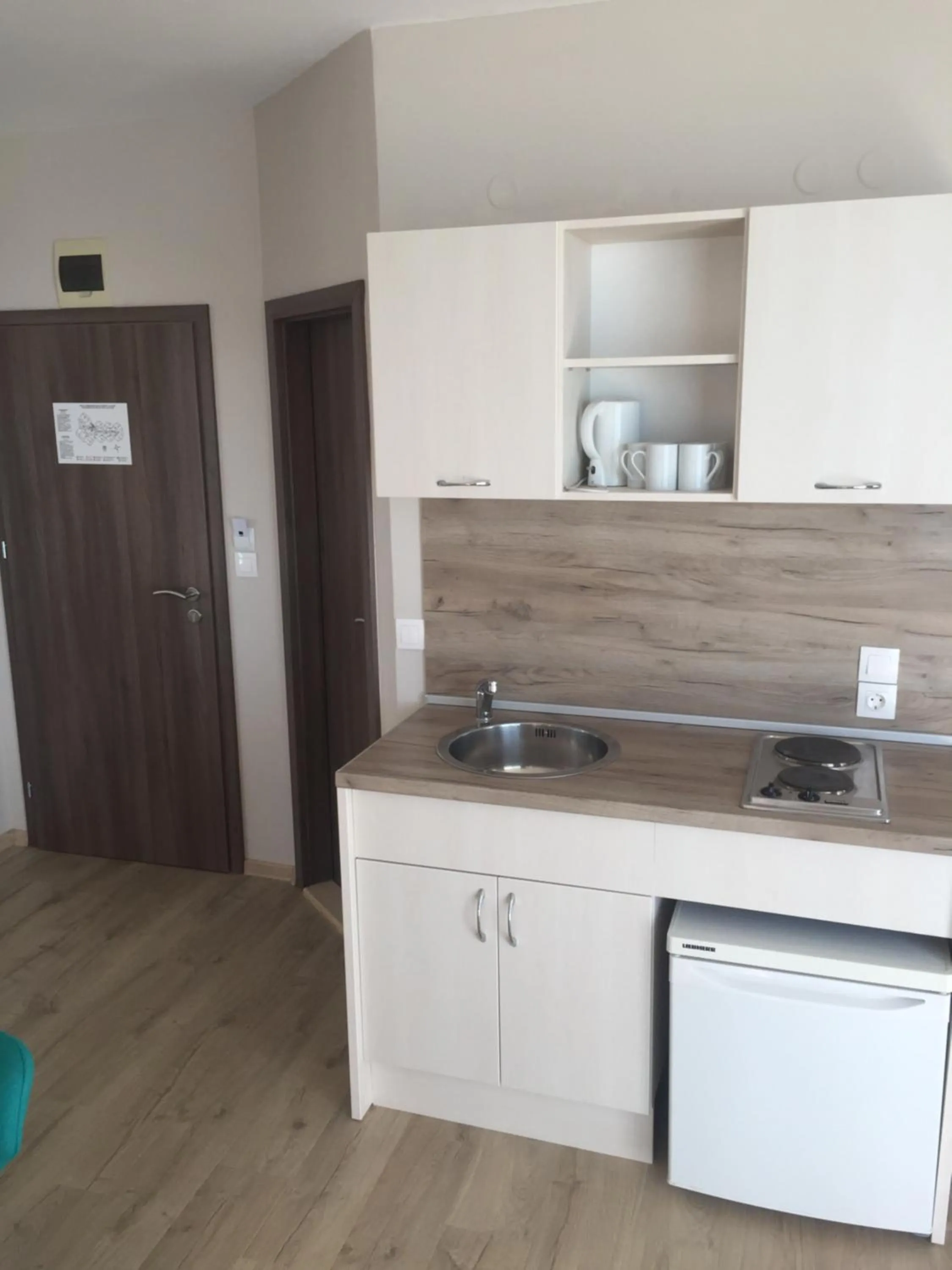 Kitchen or kitchenette in Helios Hotel