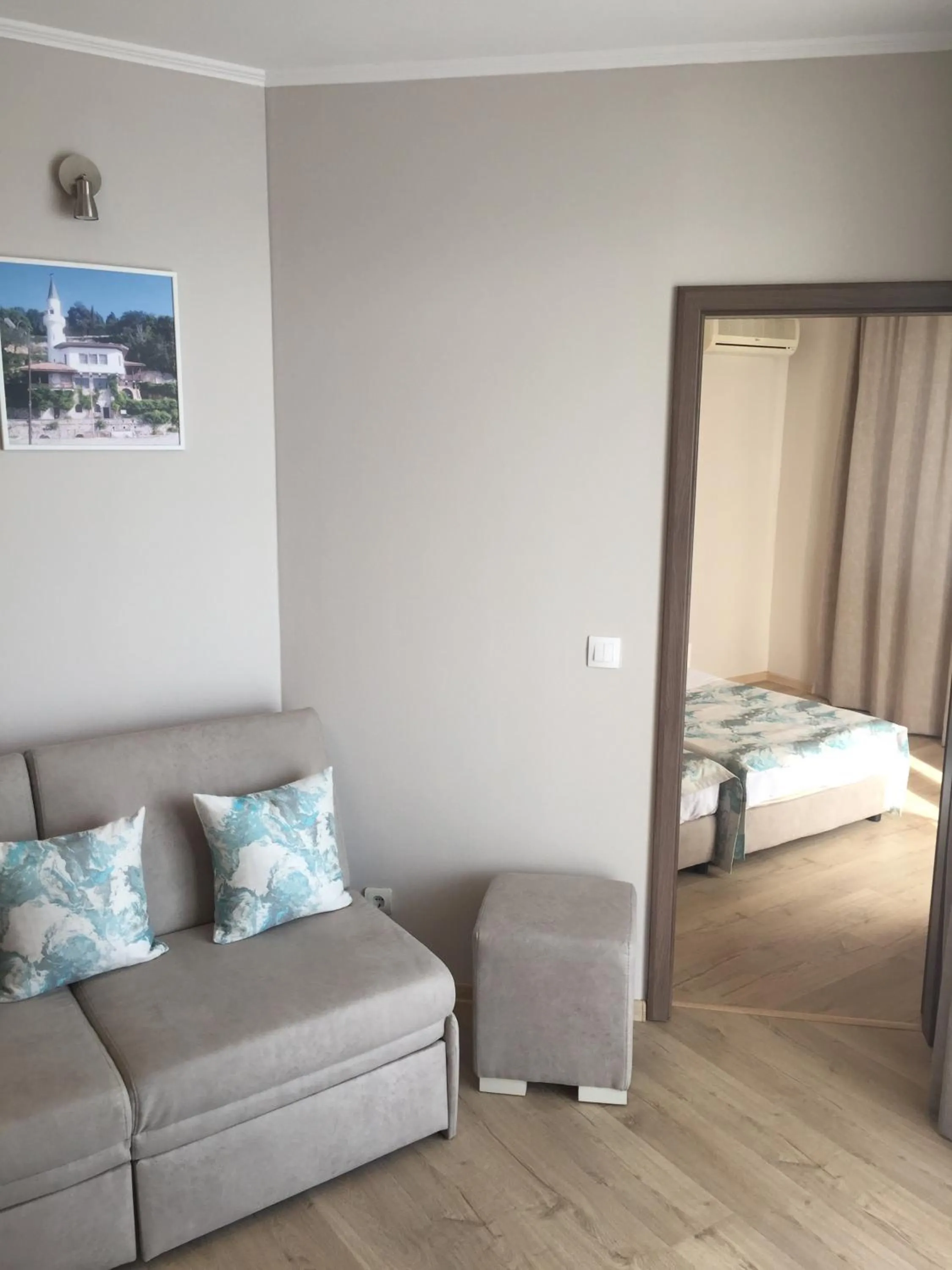 Living room, Bed in Helios Hotel