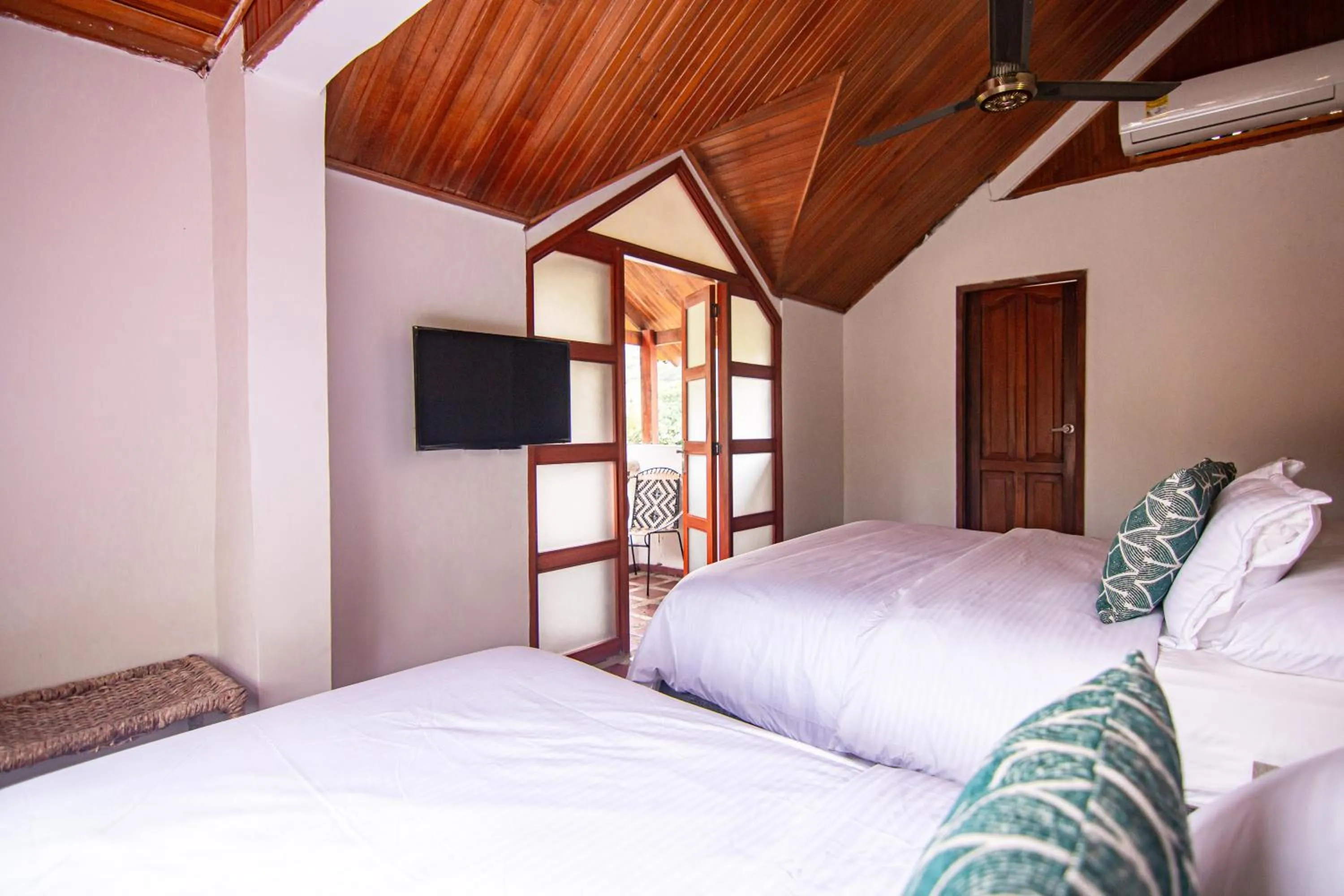 Bed in Portales del Tayrona Garden Hotel