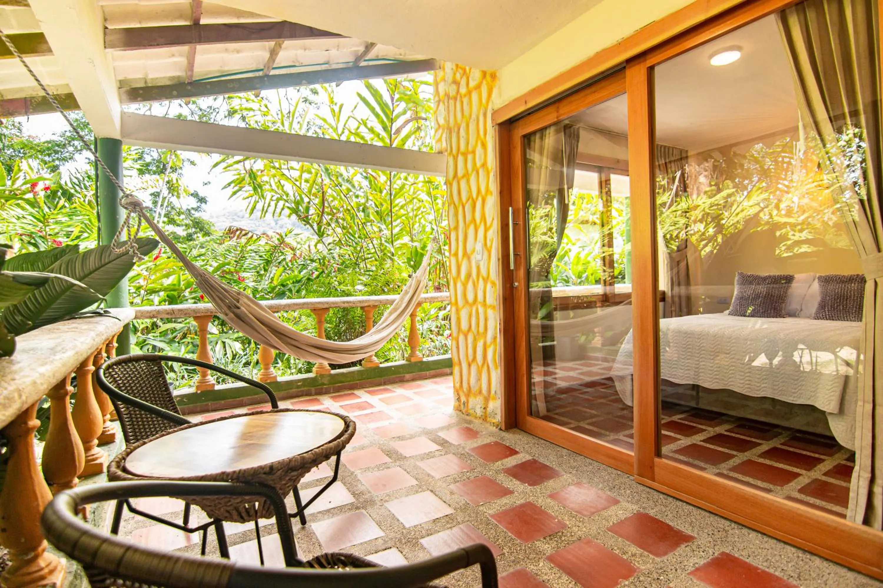 Balcony/Terrace, Bed in Portales del Tayrona Garden Hotel