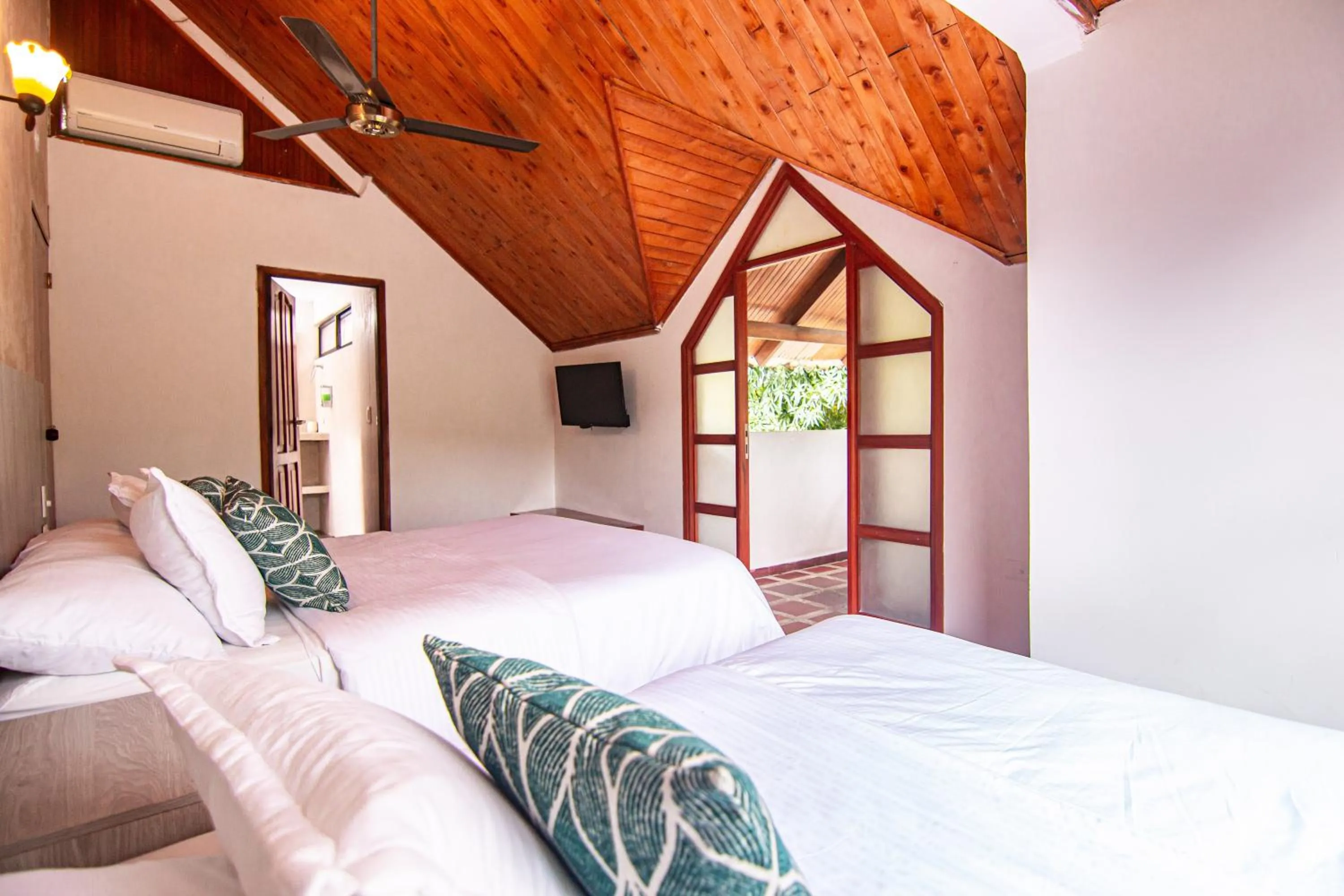 Bed in Portales del Tayrona Garden Hotel