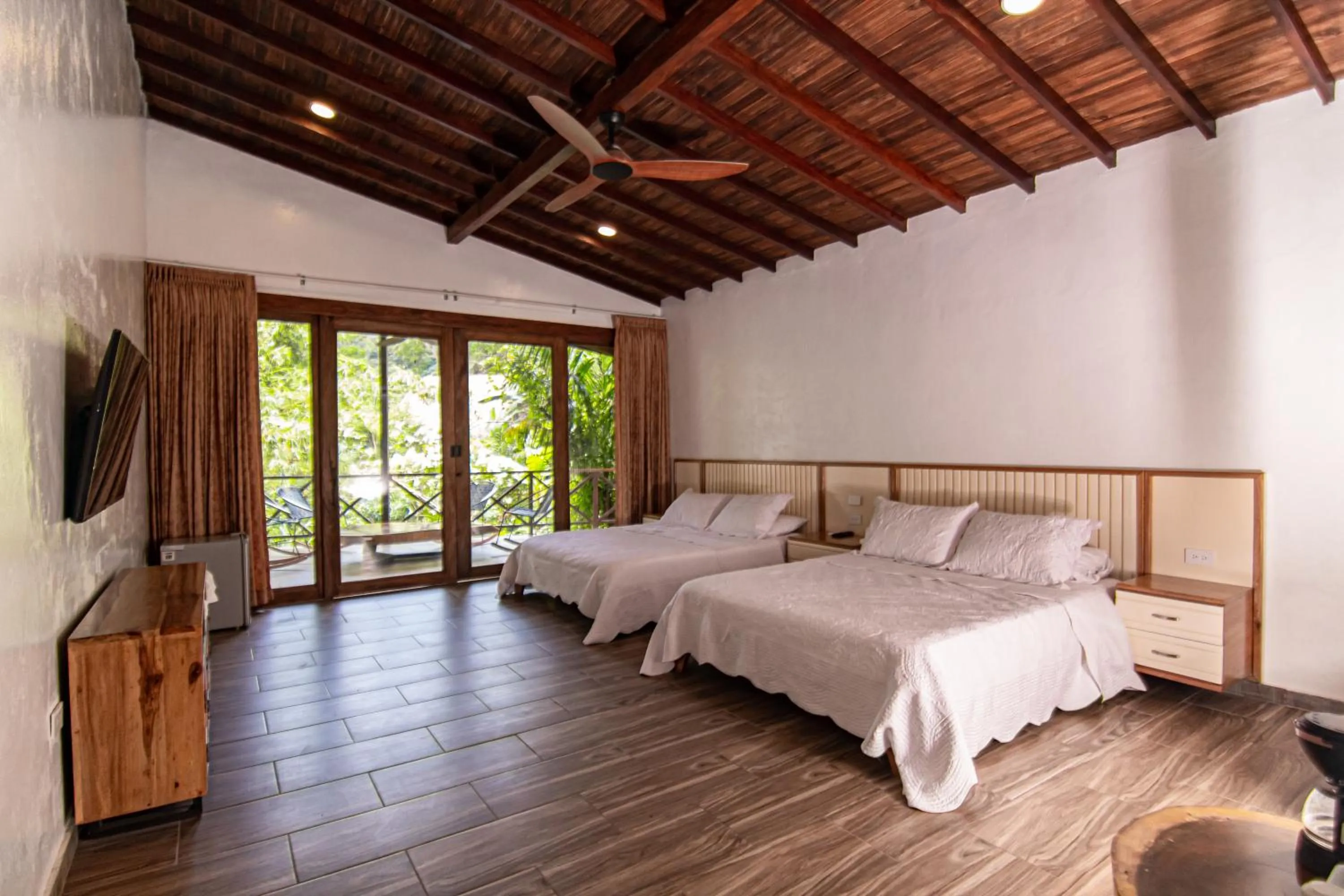 Photo of the whole room, Bed in Portales del Tayrona Garden Hotel