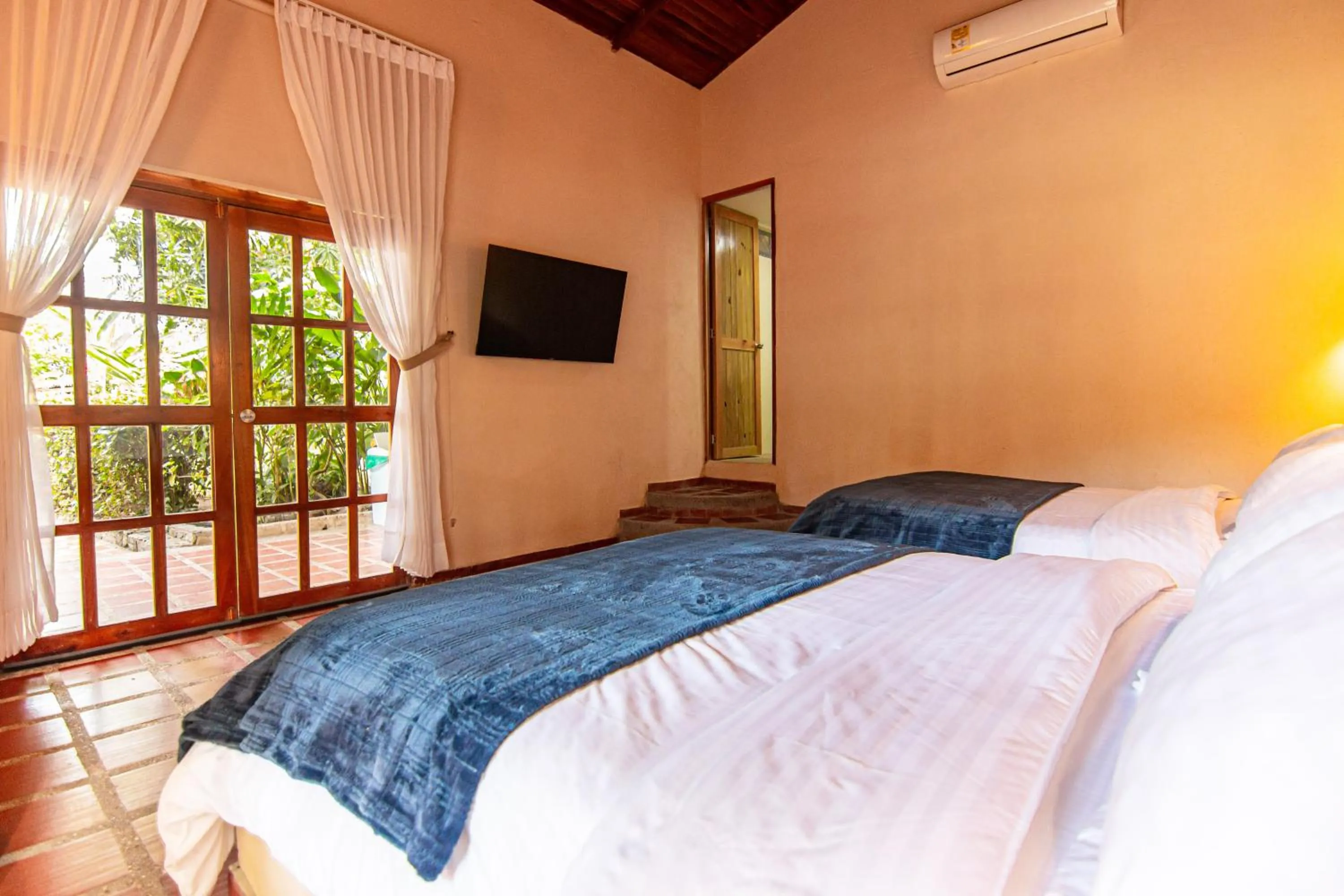 Bed in Portales del Tayrona Garden Hotel