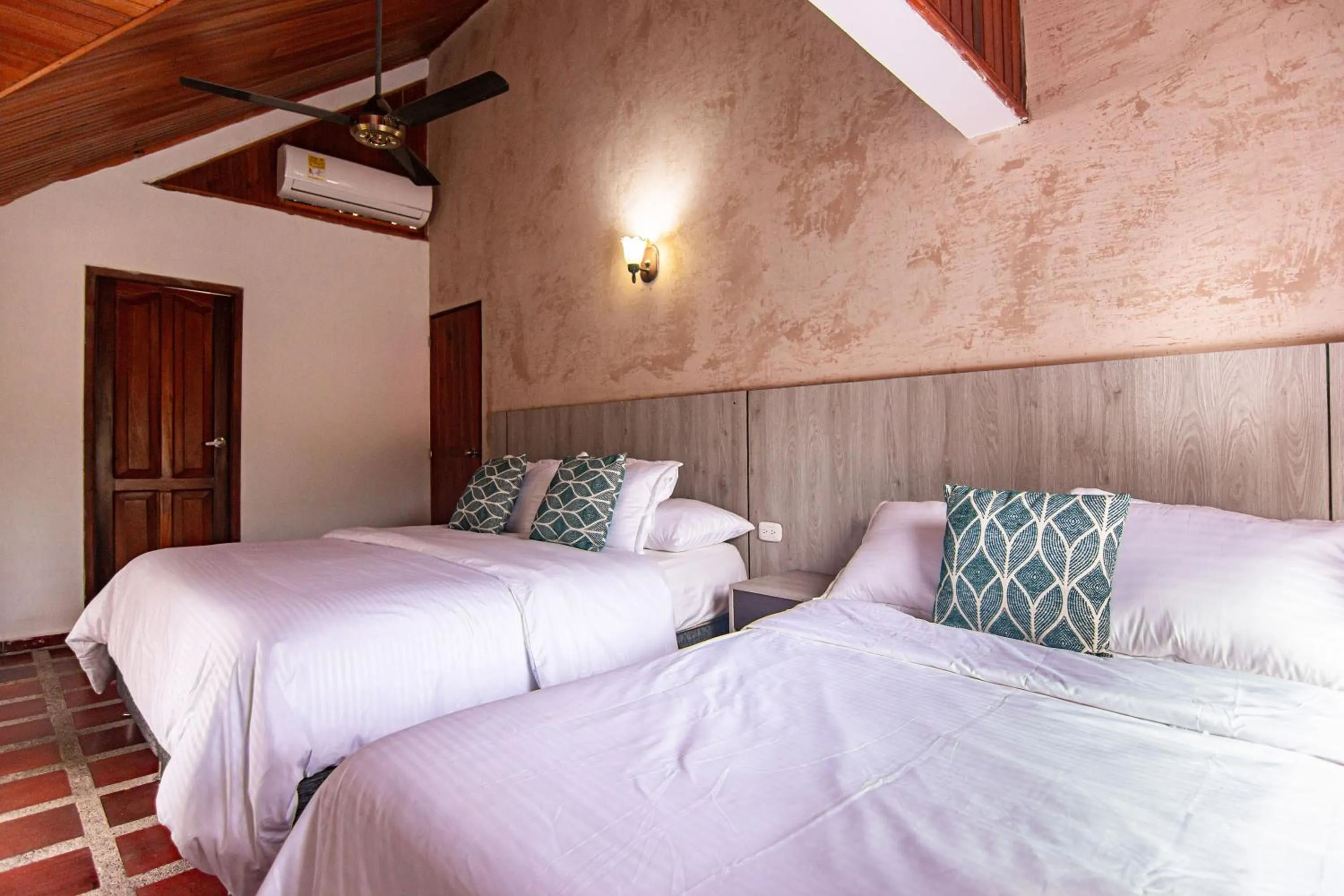 Bed in Portales del Tayrona Garden Hotel