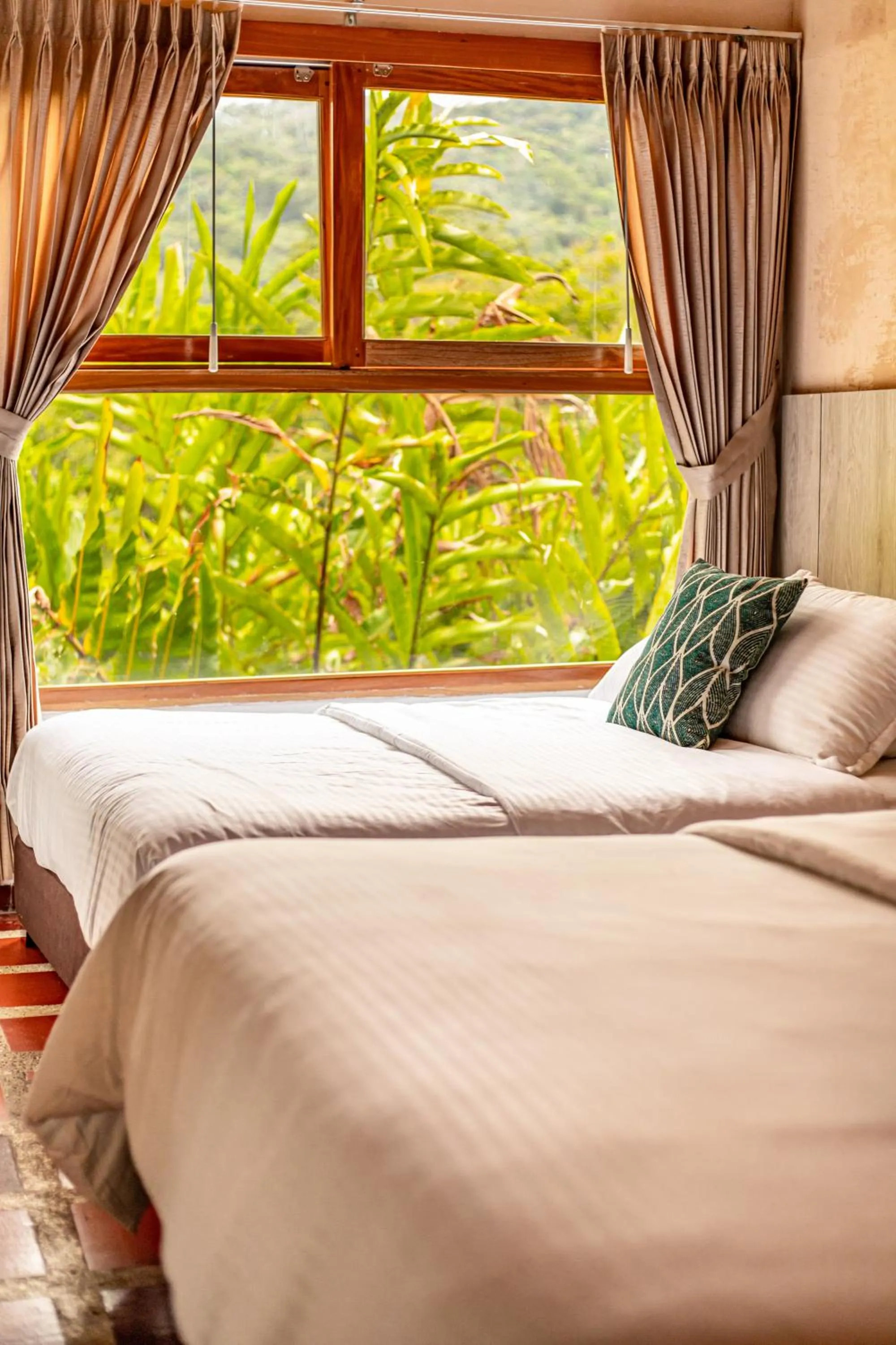Bed in Portales del Tayrona Garden Hotel