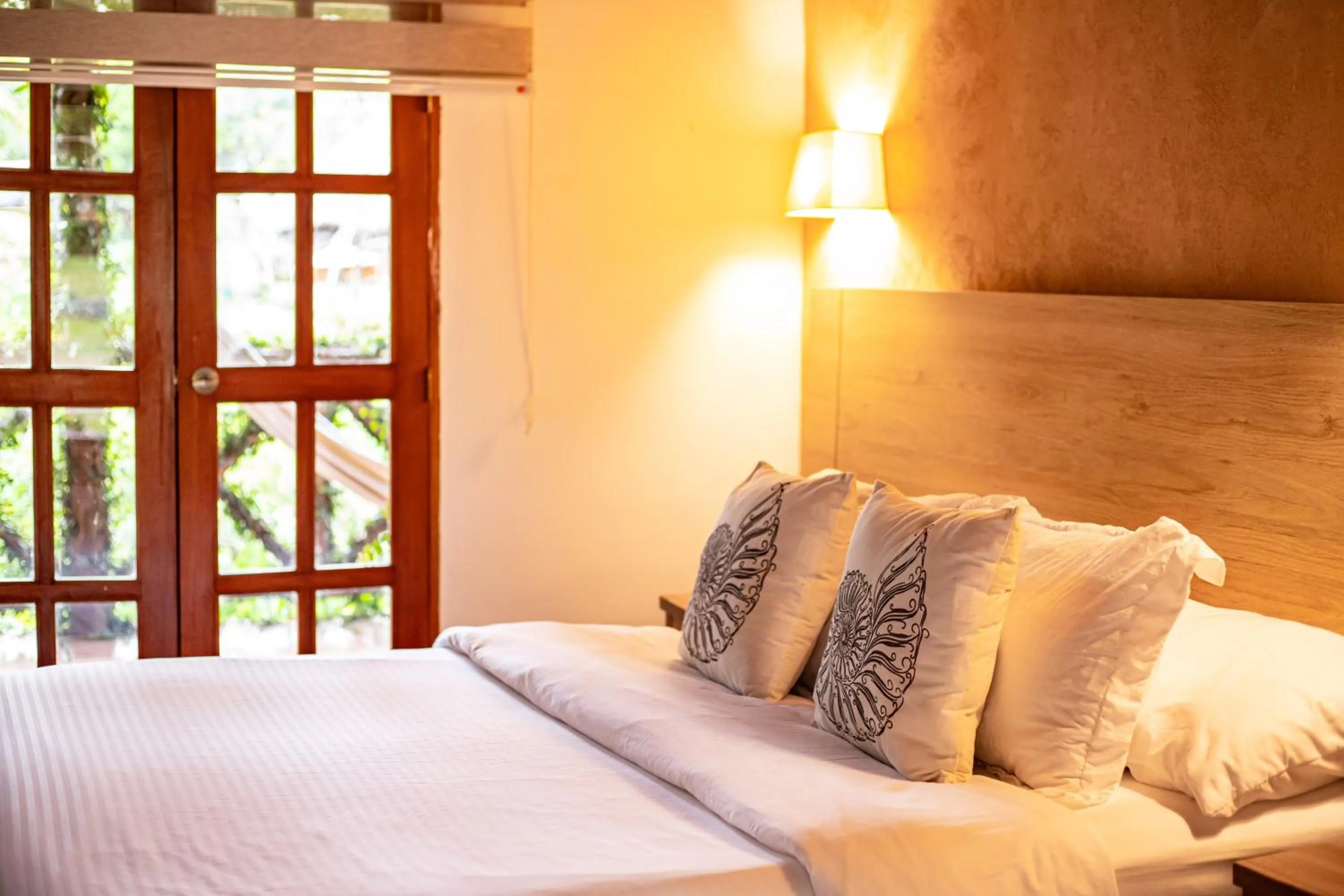 Bed in Portales del Tayrona Garden Hotel
