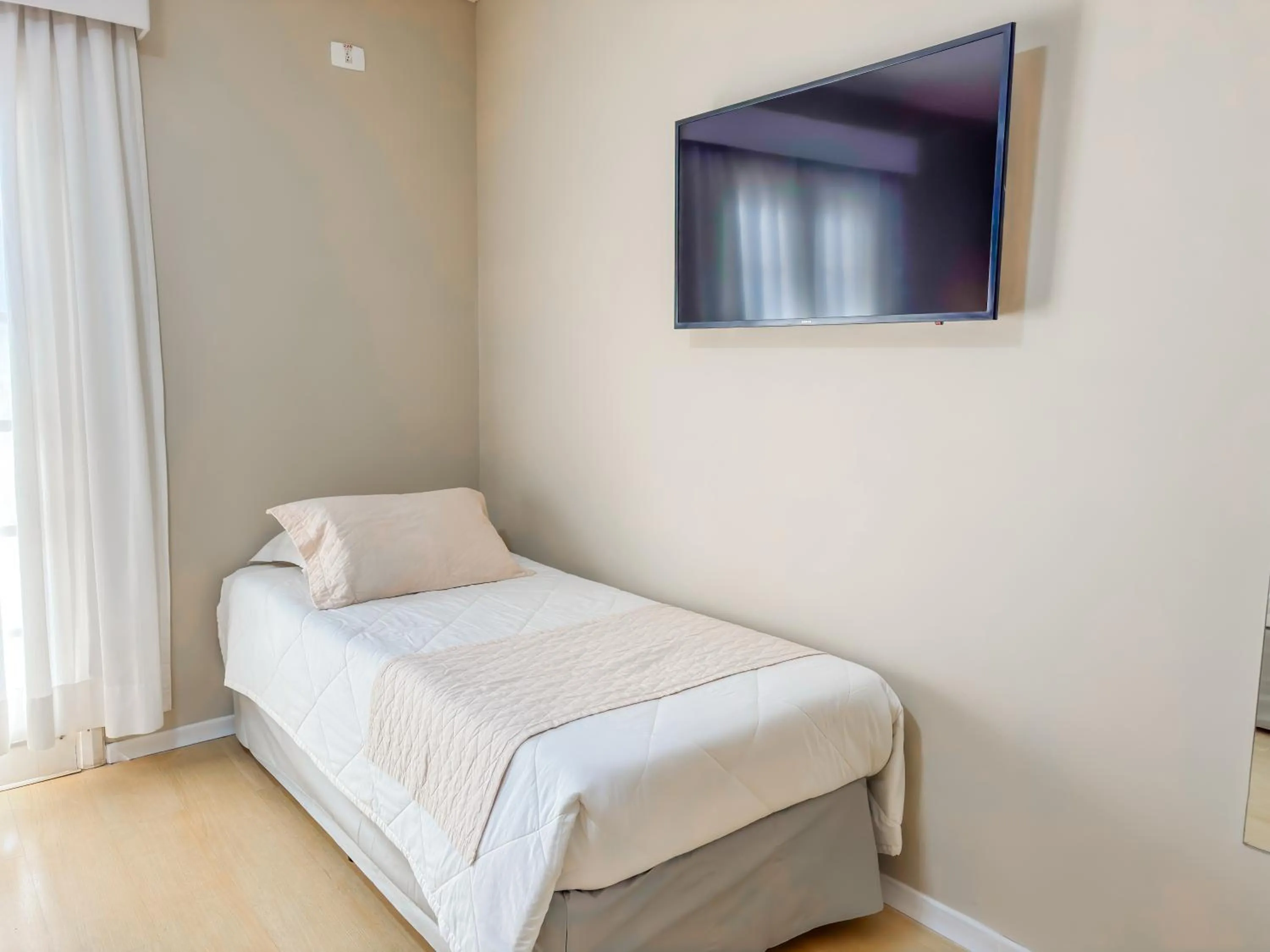 Bed in Pousada Nacional Inn Campos do Jordão