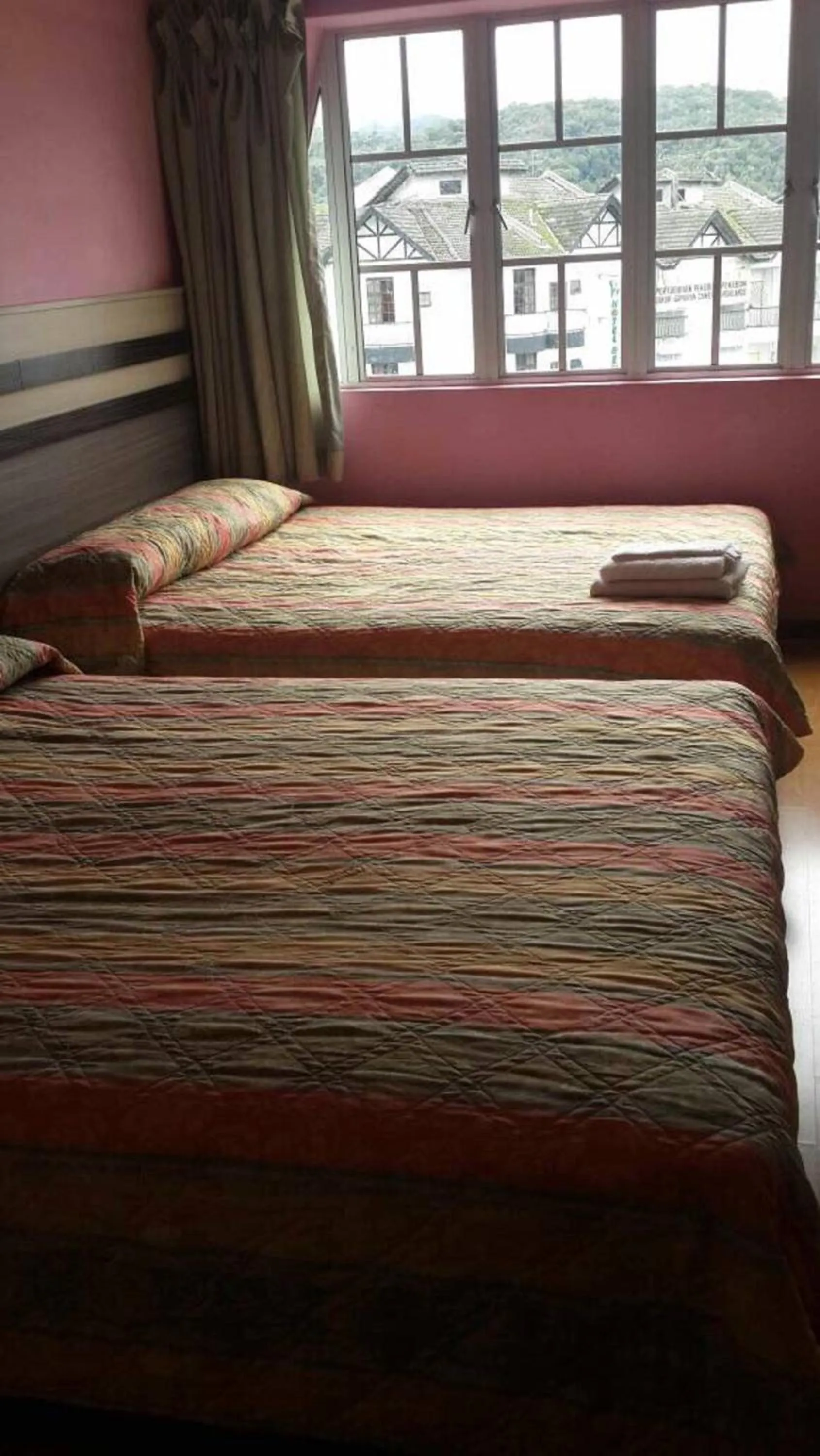 Bed in Golden Night Hotel Cameron Highlands