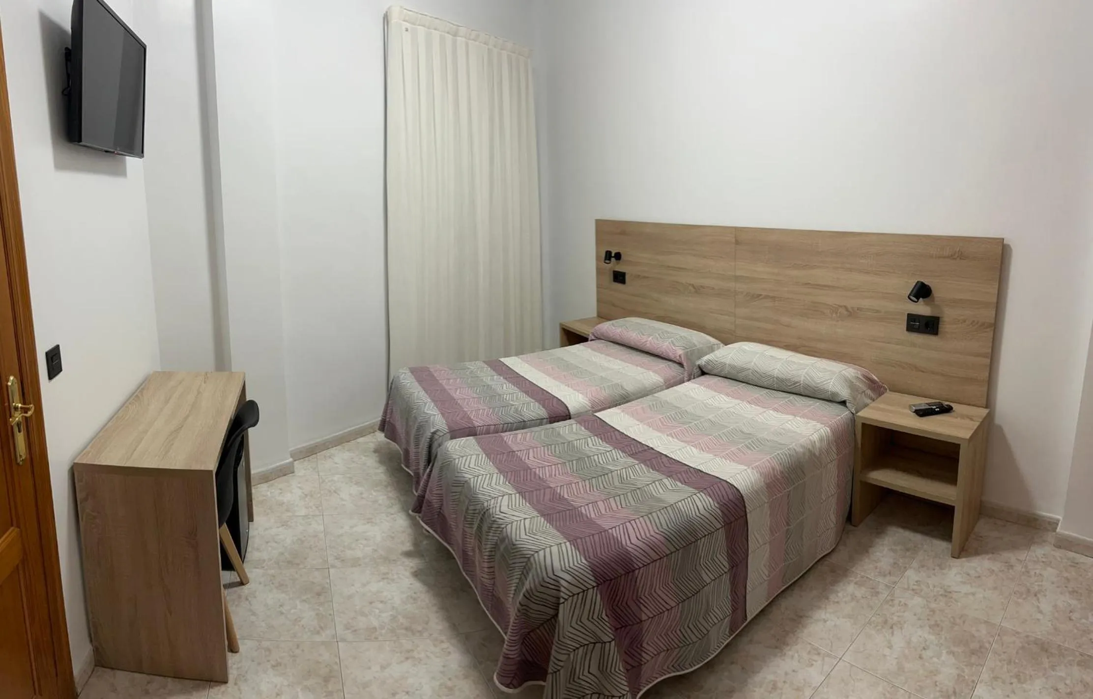 Bed in Hostal Juan Carlos