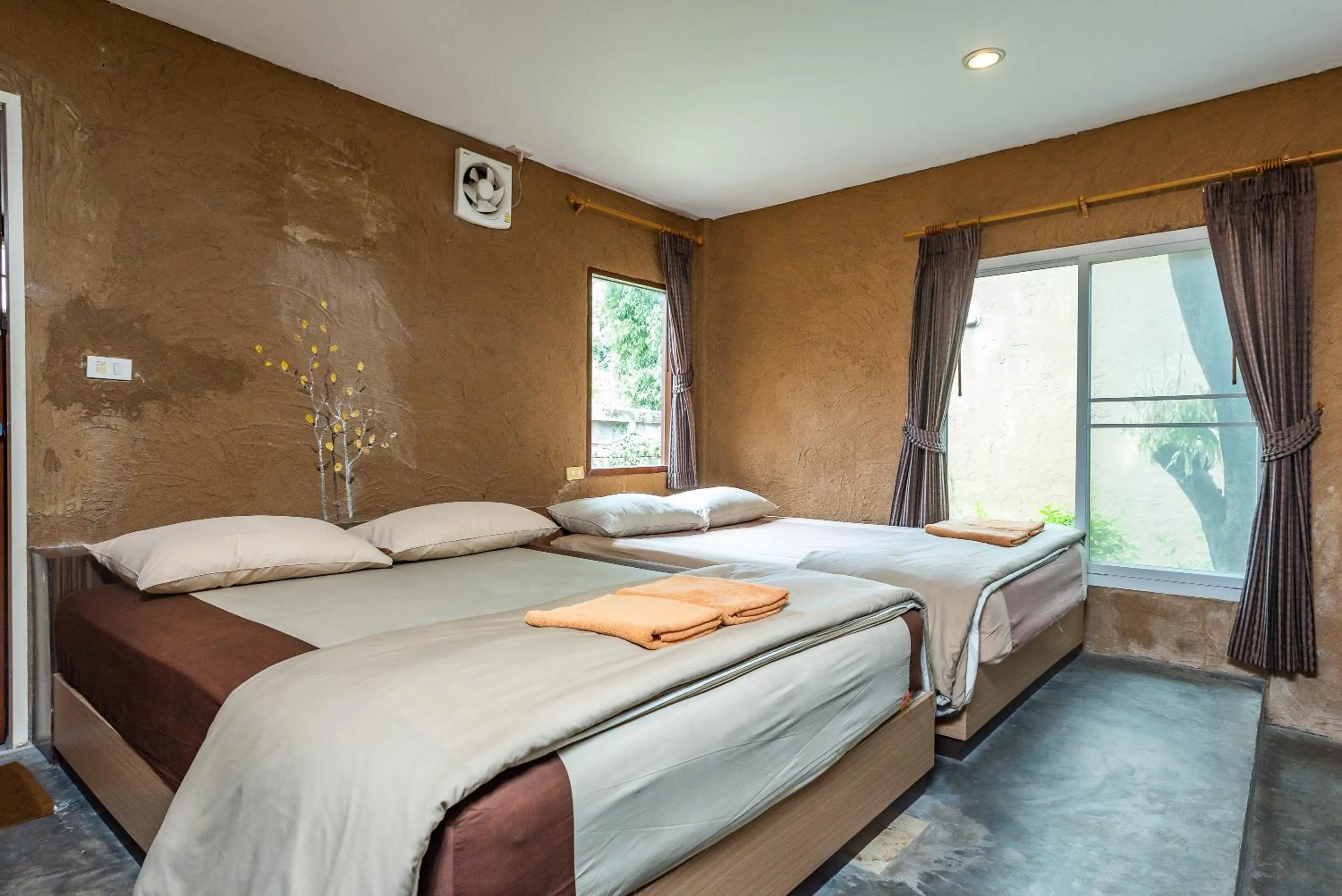 Bed in Muntra Garden Resort