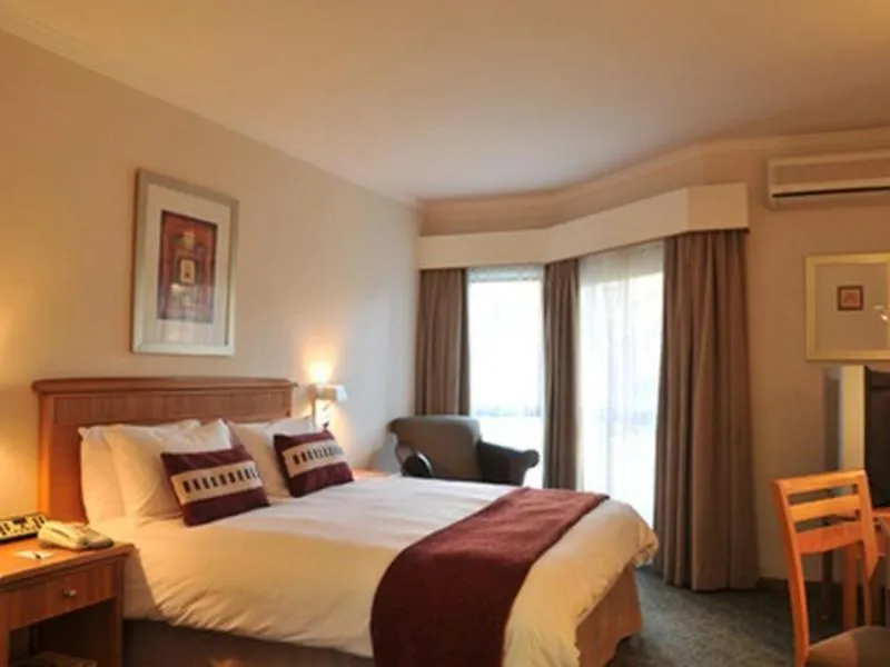 Swimming pool, Bed in Constantia Hotel and Conference Centre