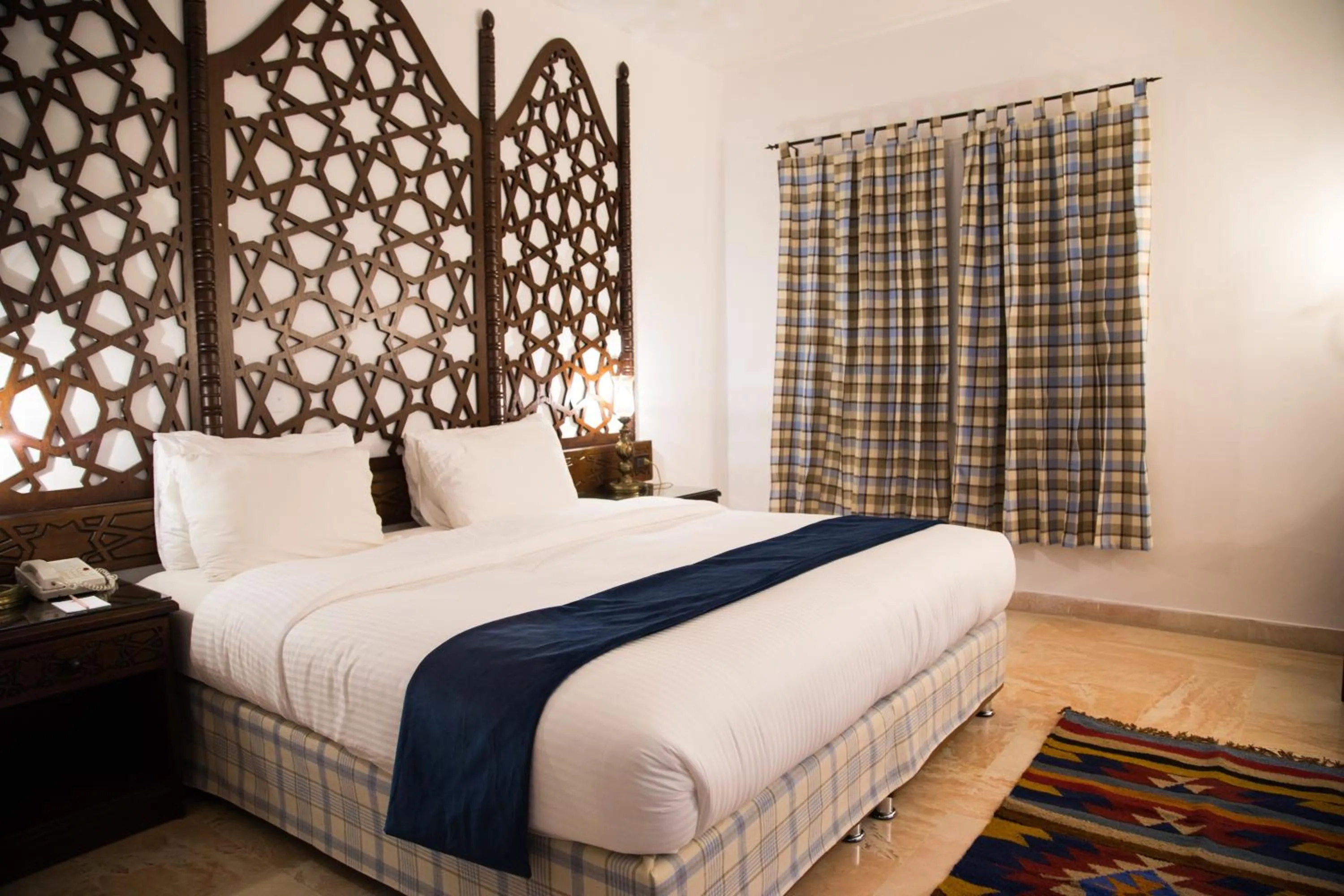 Bed in The Old Village Hotel & Resort