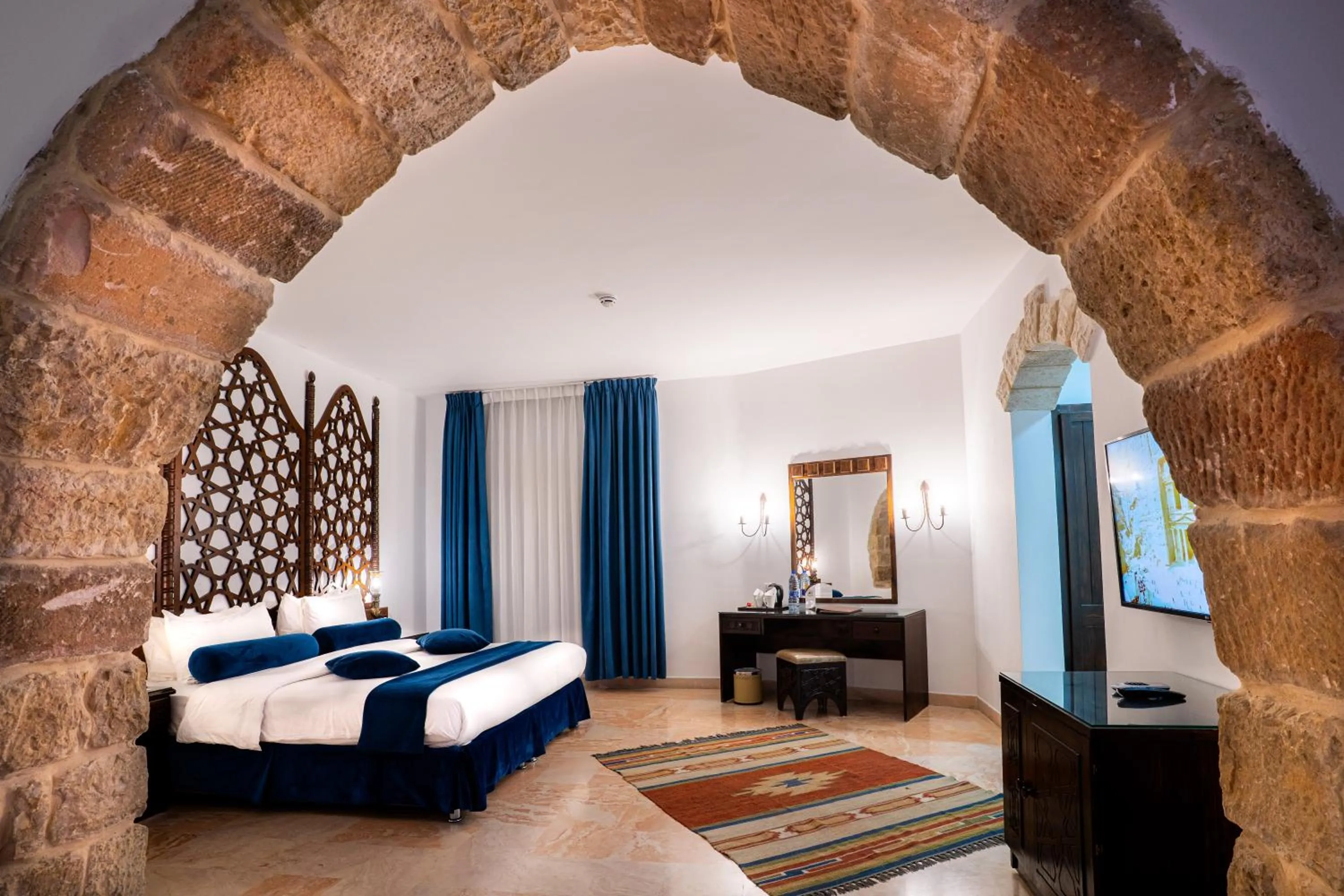 Bed in The Old Village Hotel & Resort