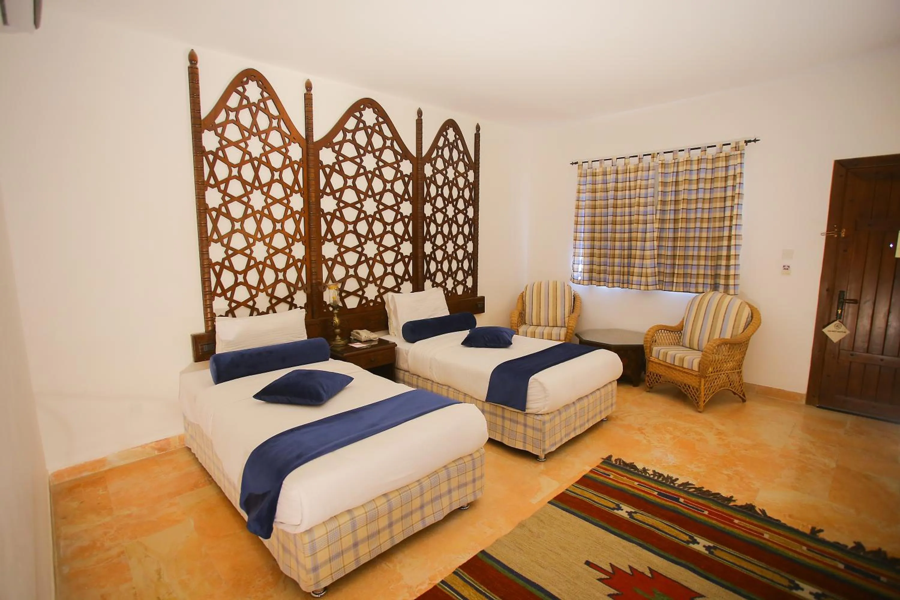 Bed in The Old Village Hotel & Resort