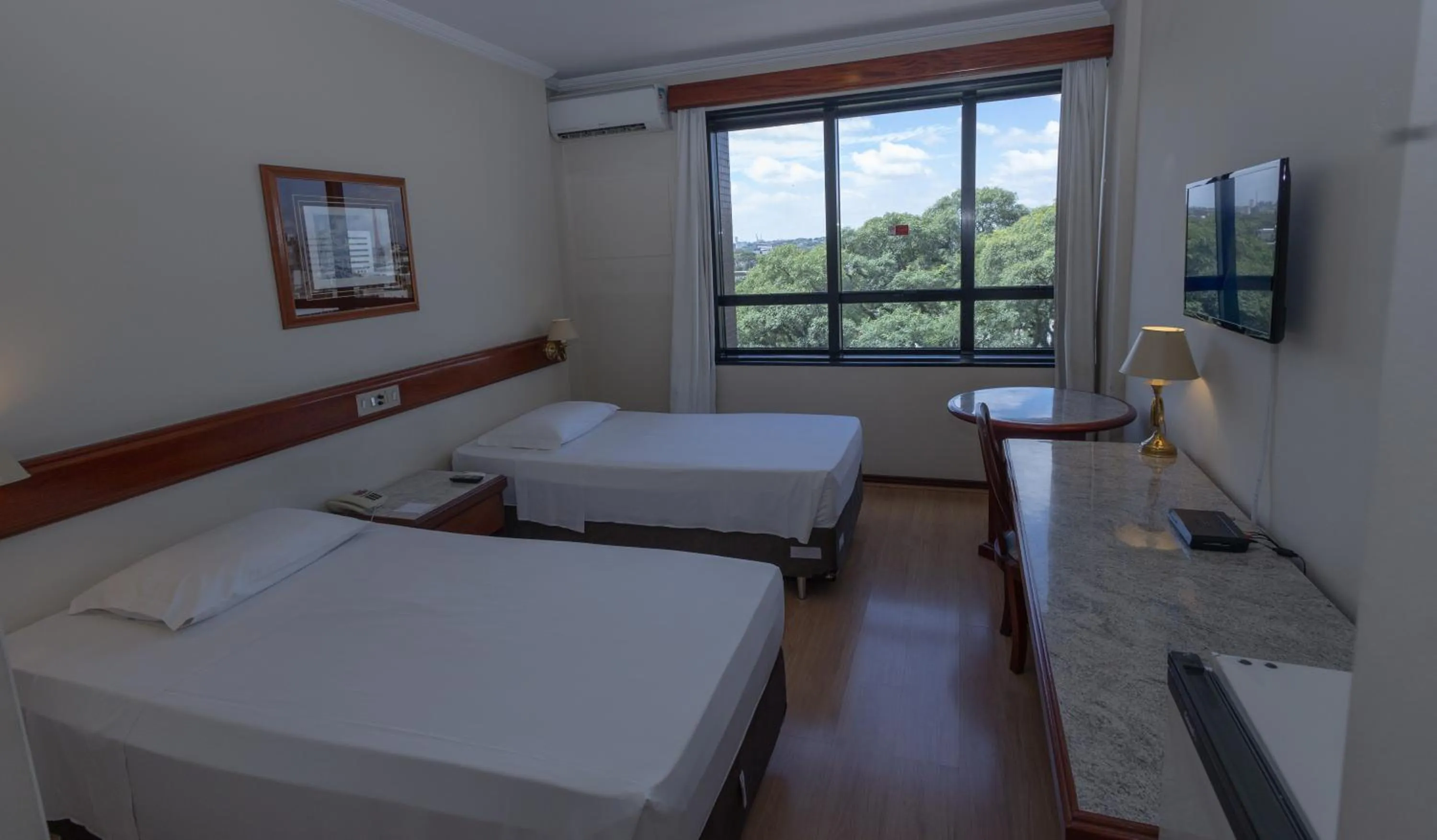 Bed in Lizon Curitiba Hotel