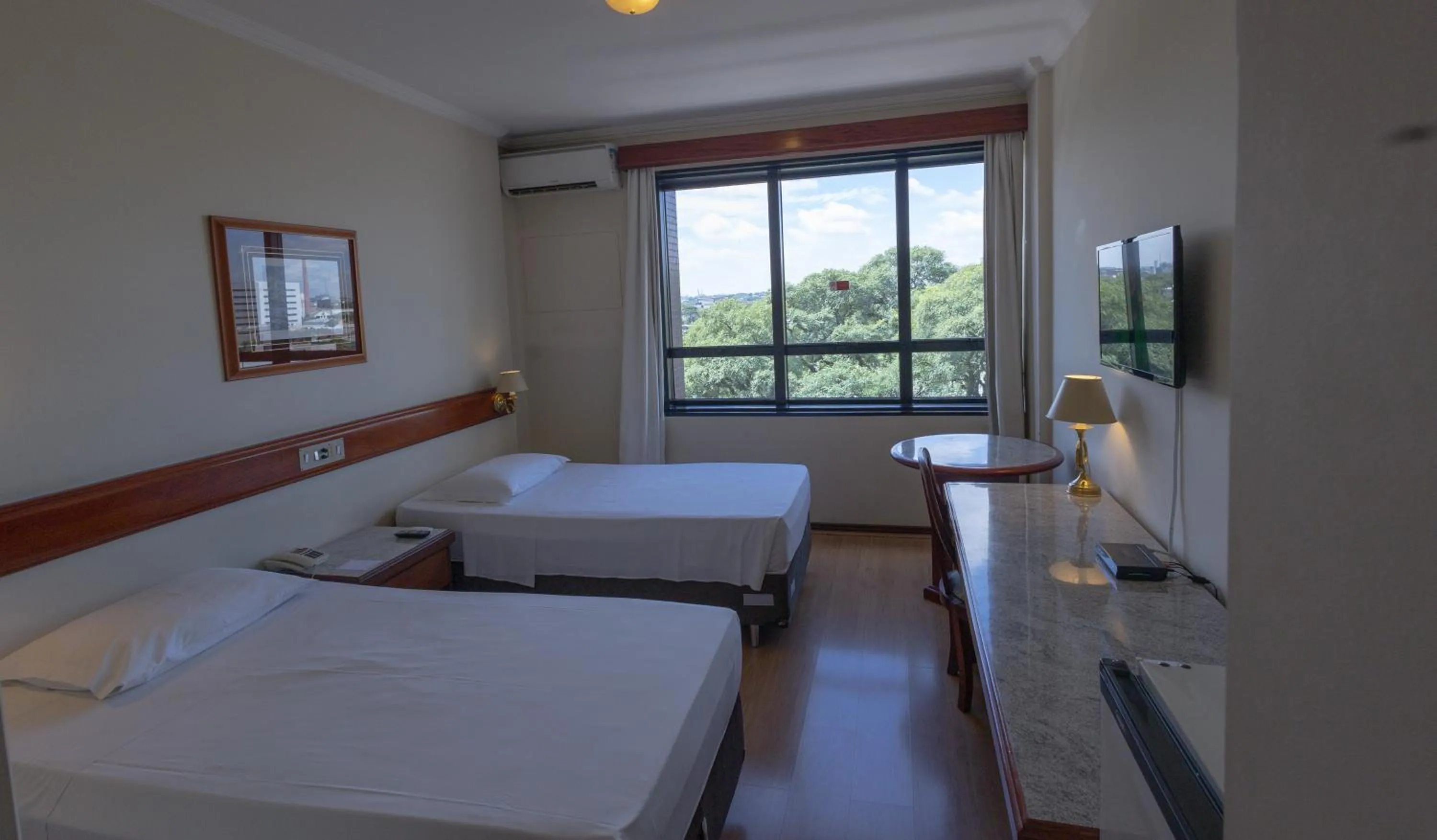 Bed in Lizon Curitiba Hotel