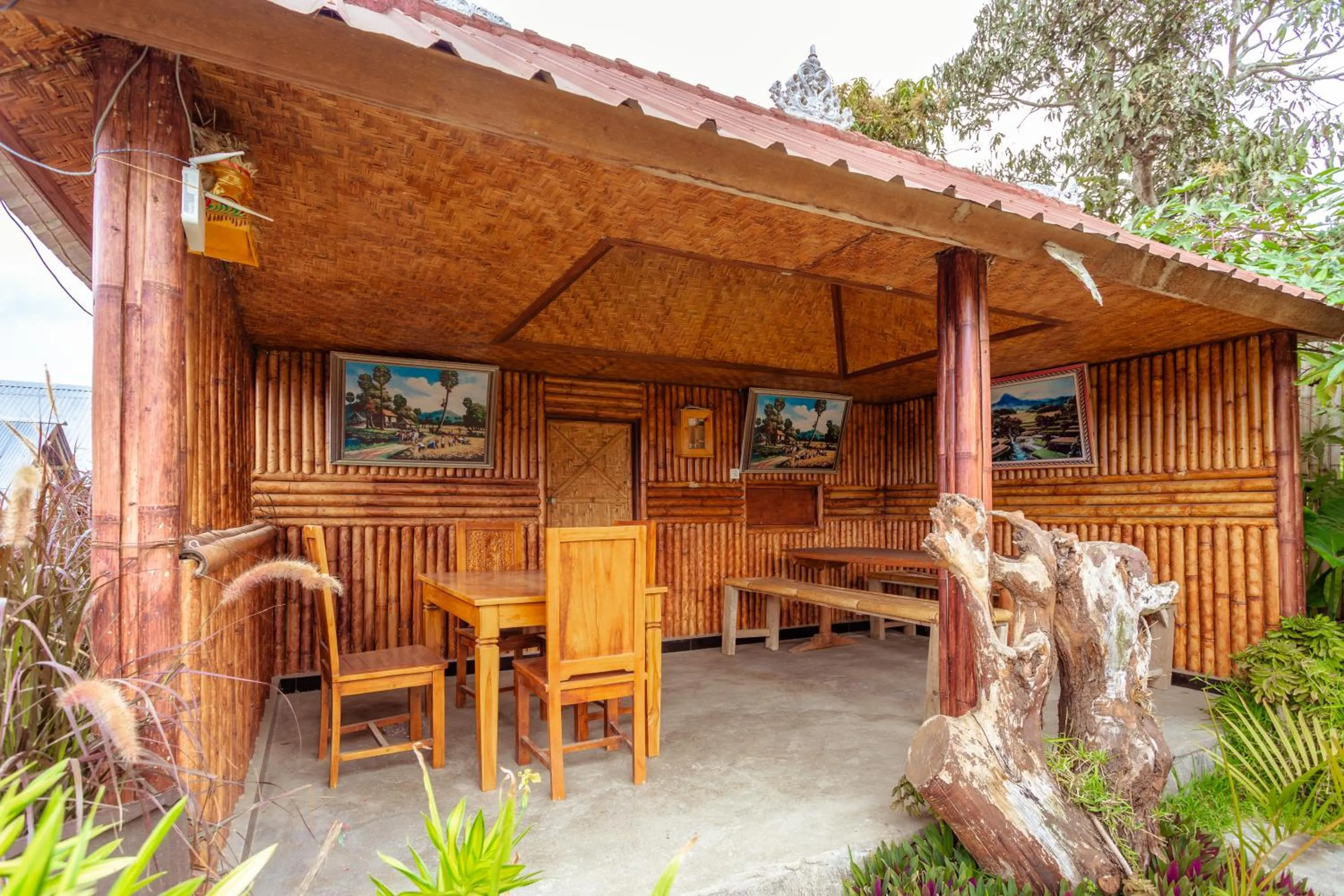 Seating area in Batur Bamboo Cabin by ecommerceloka