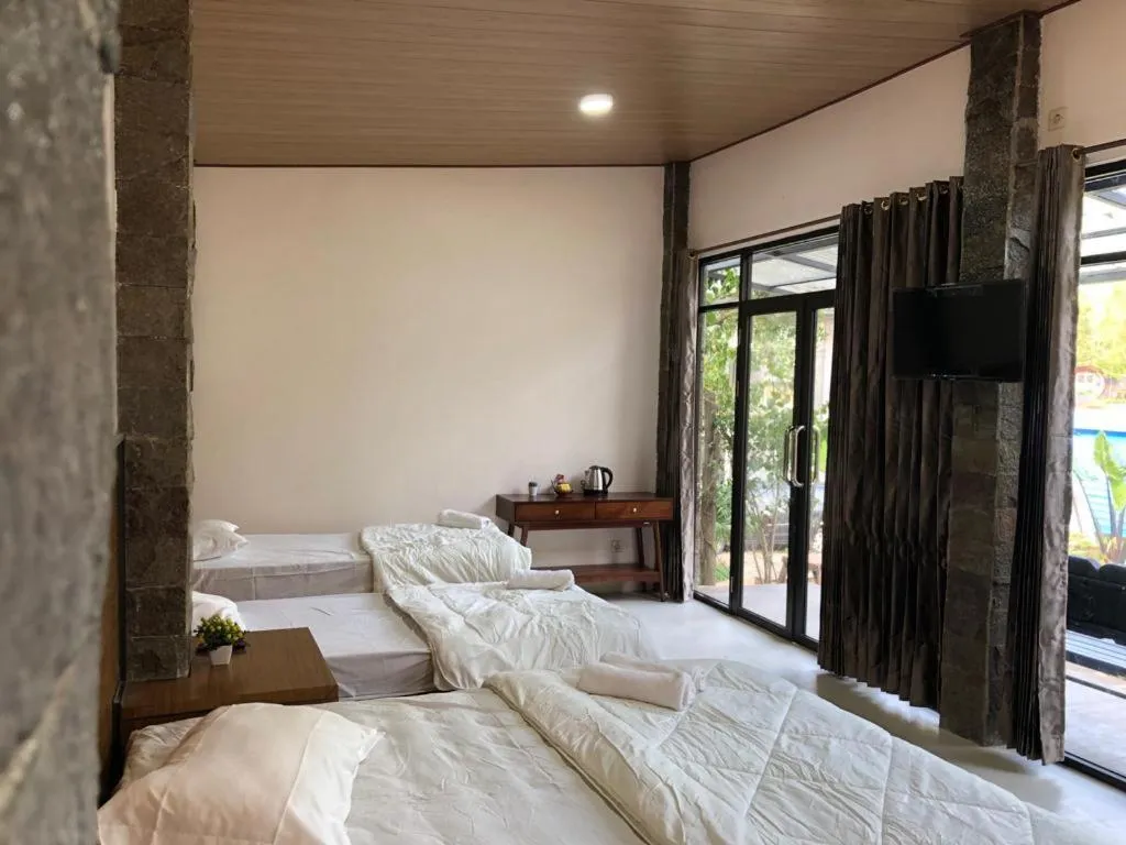 Bed in Bromo Camp House
