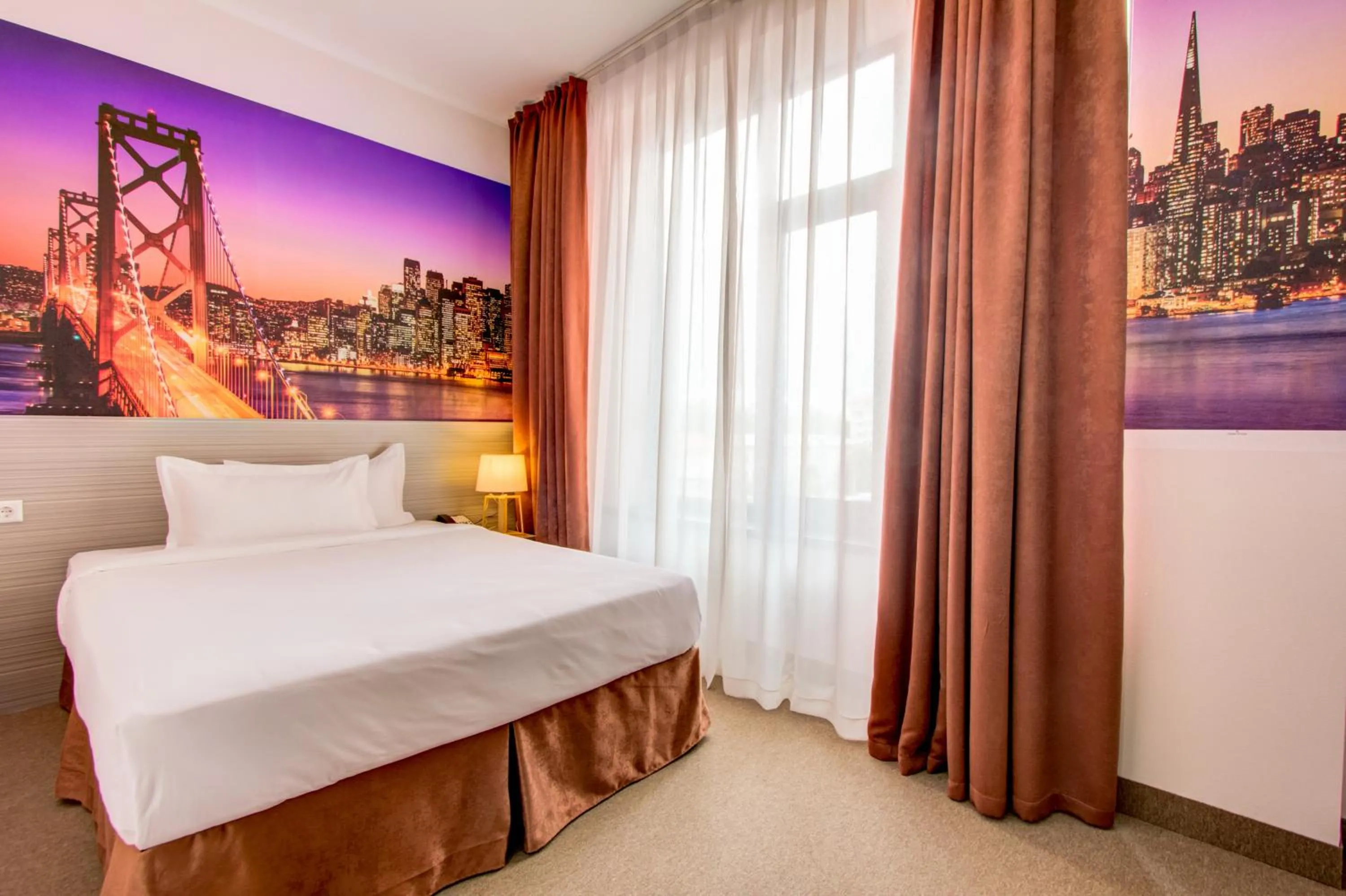 Bed in Hotel Bridges Bishkek