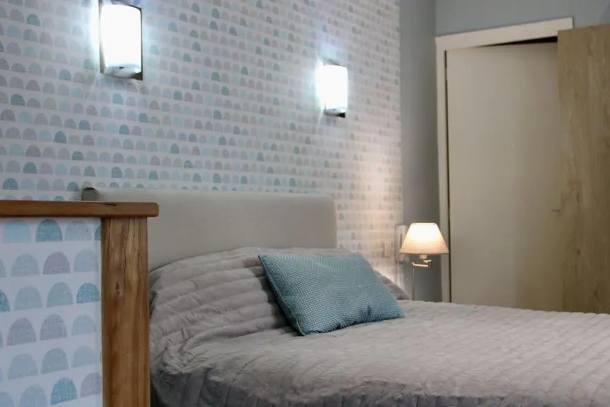 Bed in Logis Hôtel L'Ayguelade