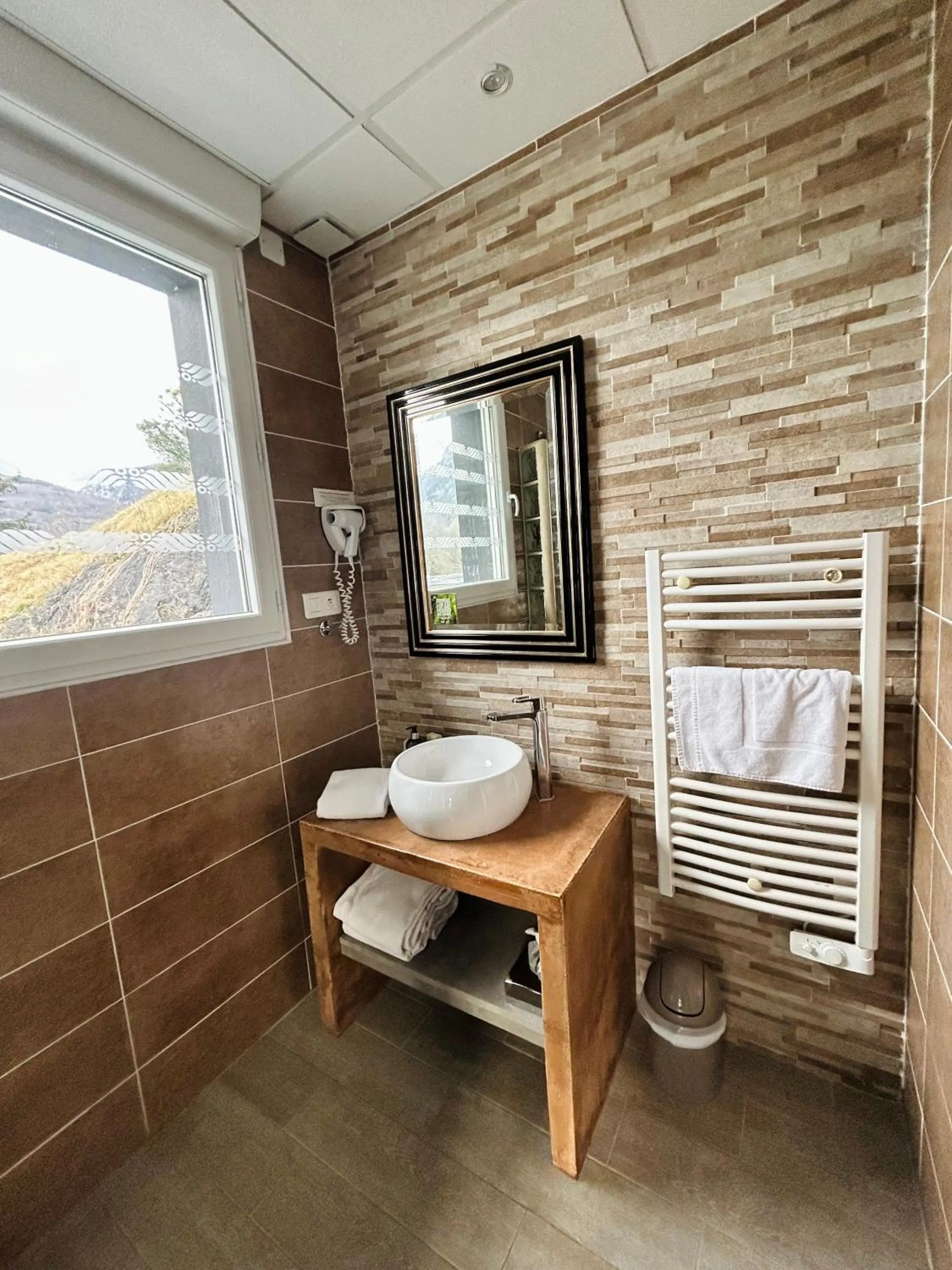 Bathroom in Logis Hôtel L'Ayguelade