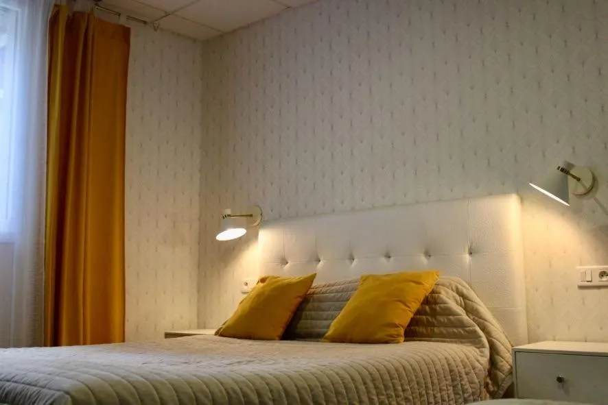 Bed in Logis Hôtel L'Ayguelade