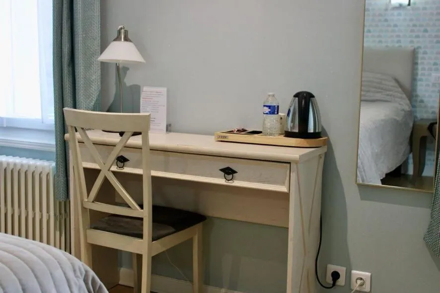 Bed in Logis Hôtel L'Ayguelade