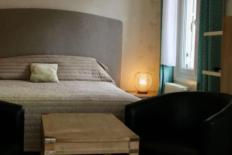 Bed in Logis Hôtel L'Ayguelade