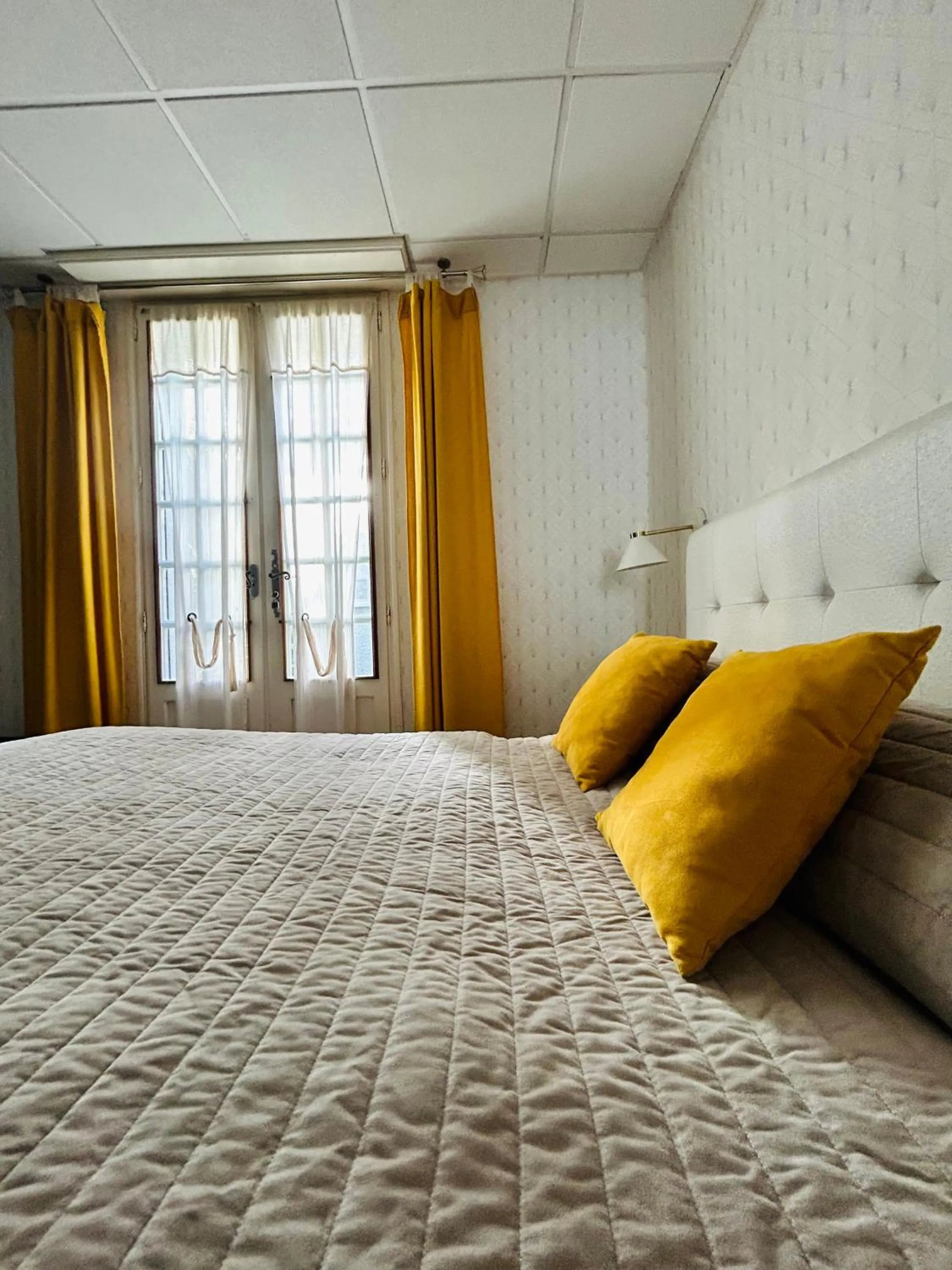 Bed in Logis Hôtel L'Ayguelade