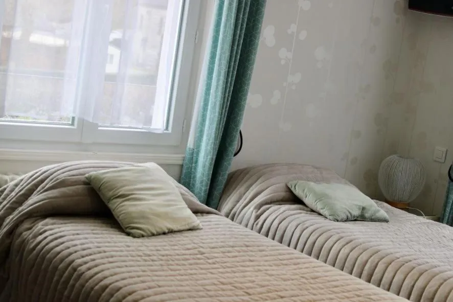 Bed in Logis Hôtel L'Ayguelade