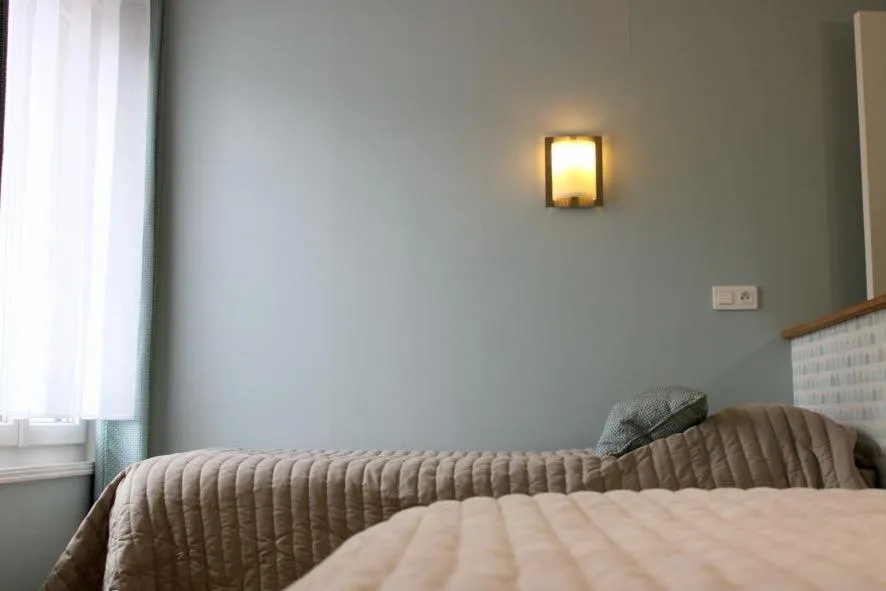 Bed in Logis Hôtel L'Ayguelade