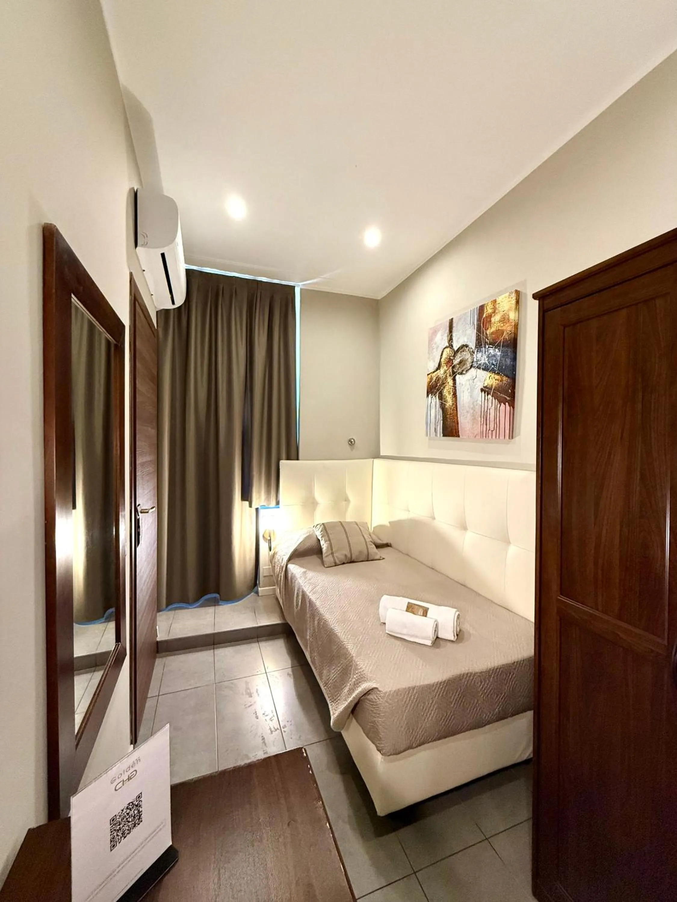 Bed in Carlo Goldoni Hotel