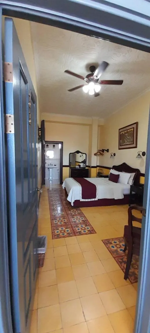 Photo of the whole room, Bed in Hotel Santo Tomas / Historical Property