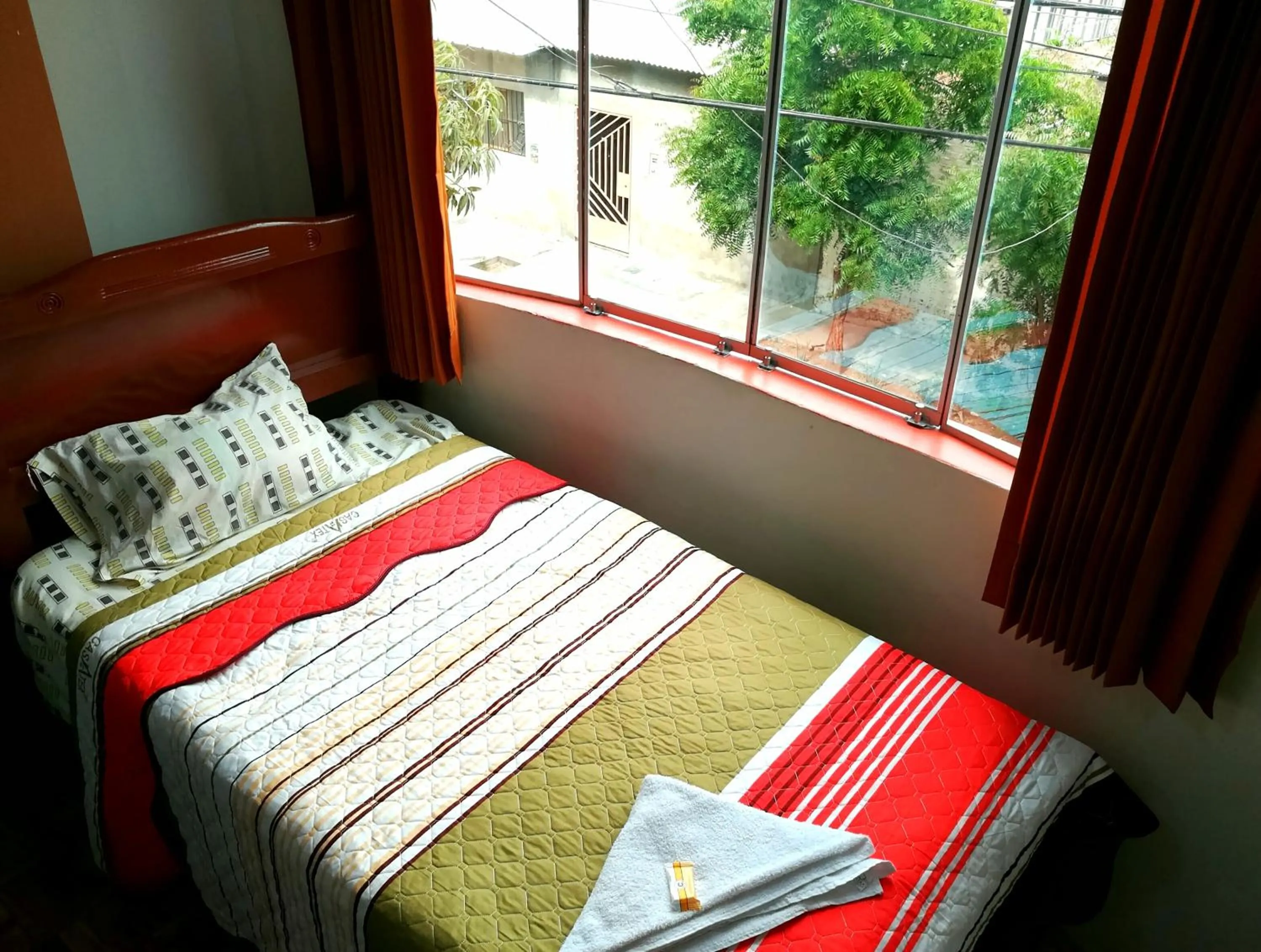 Bed in Hospedaje Central Piura
