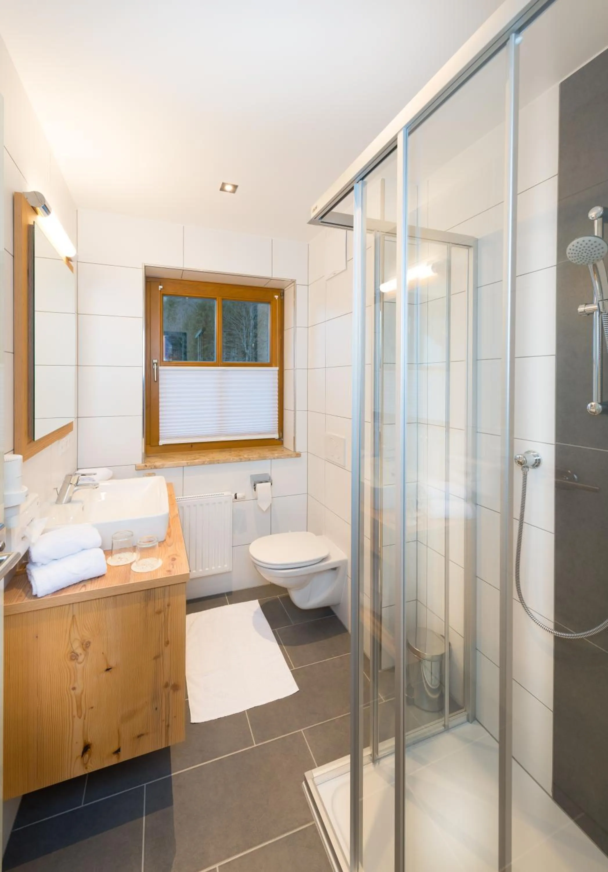 Bathroom, Bed in Hotel Dorfer